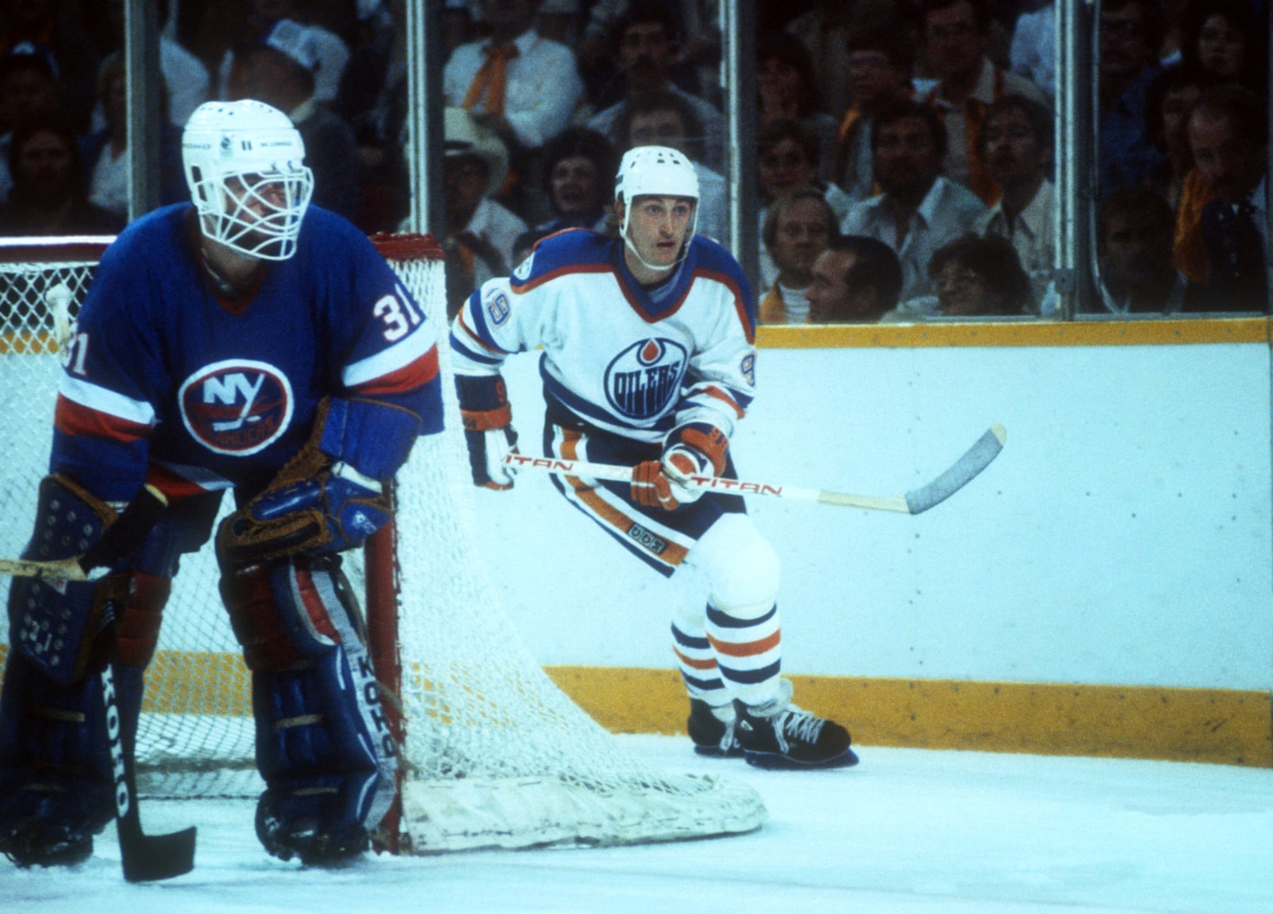 EDMONTON, AB - MAY, 1983: Wayne Gretzky #99 of the Edmonton Oilers skates around the net as goalie Billy Smith #31 of the New York Islanders follows the play during the 1983 Stanley Cup Finals circa May, 1983 at the Northlands Coliseum in Edmonton, Alberta, Canada. (Photo by Bruce Bennett Studios via Getty Images Studios/Getty Images) EDMONTON, AB - MAY, 1983: Wayne Gretzky #99 of the Edmonton Oilers skates around the net as goalie Billy Smith #31 of the New York Islanders follows the play during the 1983 Stanley Cup Finals circa May, 1983 at the Northlands Coliseum in Edmonton, Alberta, Canada. (Photo by Bruce Bennett Studios via Getty Images Studios/Getty Images)