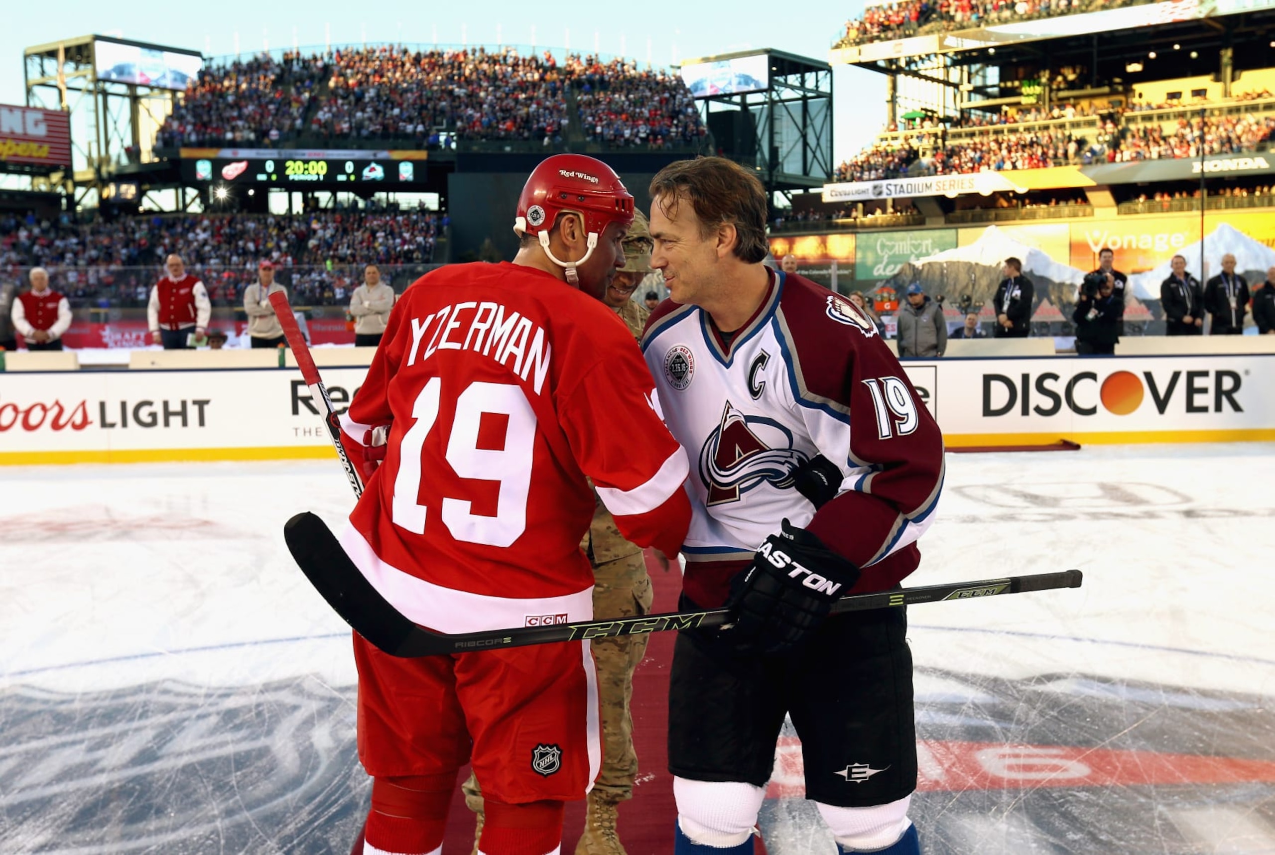 DENVER, CO - FEBRUARY 26: Steve Yzerman #19 of the Detroit Red Wings Alumni and Joe Sakic #19 of the Colorado Avalanche Alumni shake hands prior to the 2016 Coors Light Stadium Series Alumni Game at Coors Field on February 26, 2016 in Denver, Colorado. DENVER, CO - FEBRUARY 26: Steve Yzerman #19 of the Detroit Red Wings Alumni and Joe Sakic #19 of the Colorado Avalanche Alumni shake hands prior to the 2016 Coors Light Stadium Series Alumni Game at Coors Field on February 26, 2016 in Denver, Colorado.