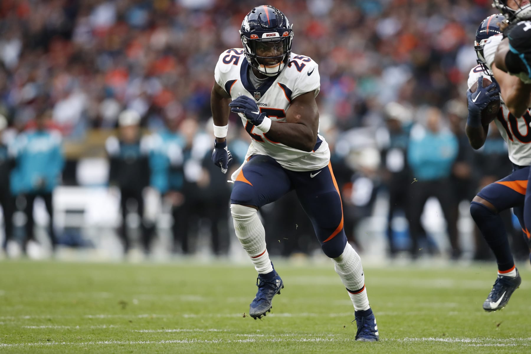 Denver Broncos running back Melvin Gordon III (25) in action during an NFL football game against the Jacksonville Jaguars at Wembley Stadium in London, Sunday, Oct. 30, 2022. The Denver Broncos defeated the Jacksonville Jaguars 21-17. (AP Photo/Steve Luciano)