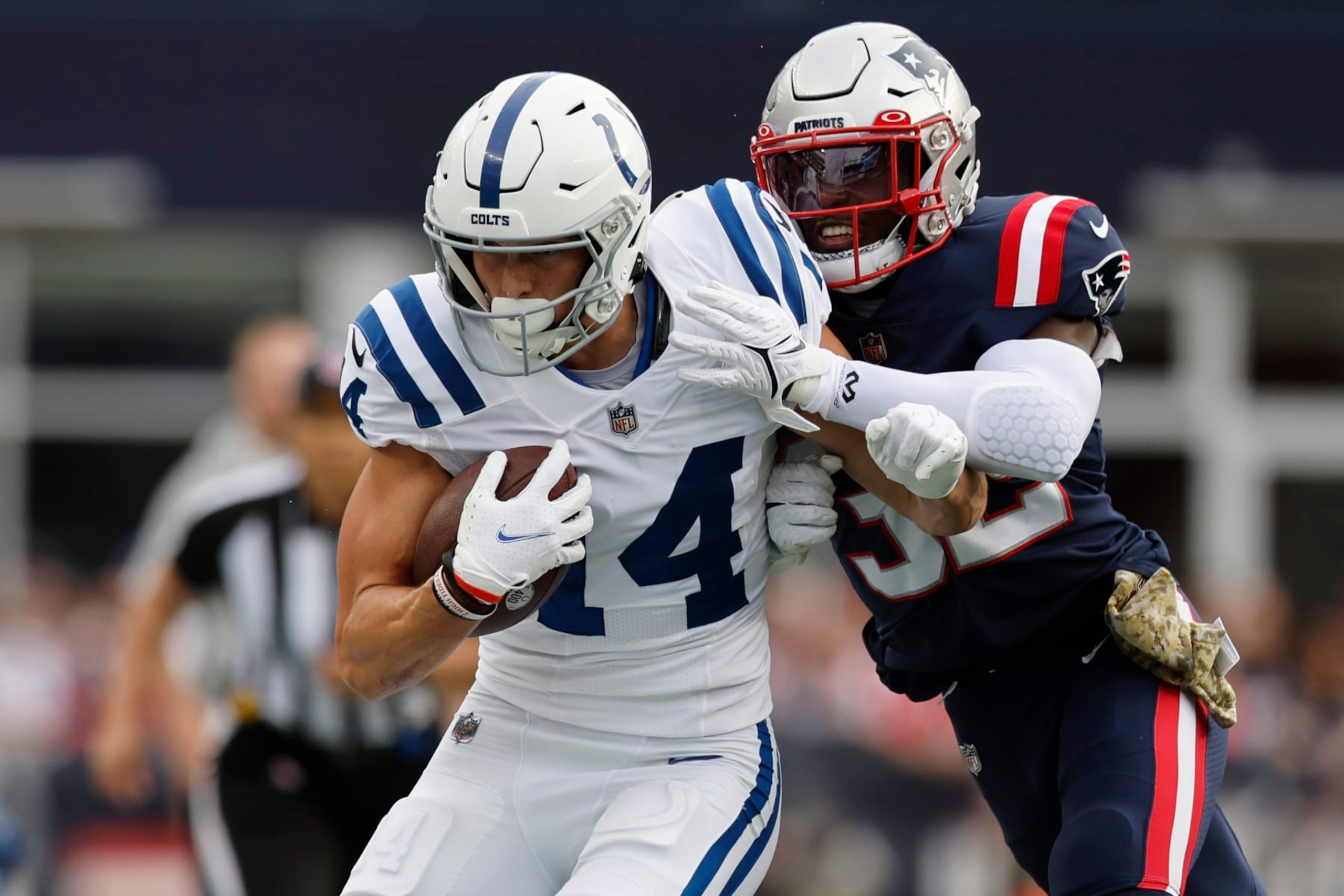 Indianapolis Colts wide receiver Alec Pierce (14) is pushed out of bounds by New England Patriots safety Devin McCourty (32) in the first half of an NFL football game, Sunday, Nov. 6, 2022, in Foxborough, Mass. (AP Photo/Michael Dwyer) Indianapolis Colts wide receiver Alec Pierce (14) is pushed out of bounds by New England Patriots safety Devin McCourty (32) in the first half of an NFL football game, Sunday, Nov. 6, 2022, in Foxborough, Mass. (AP Photo/Michael Dwyer)