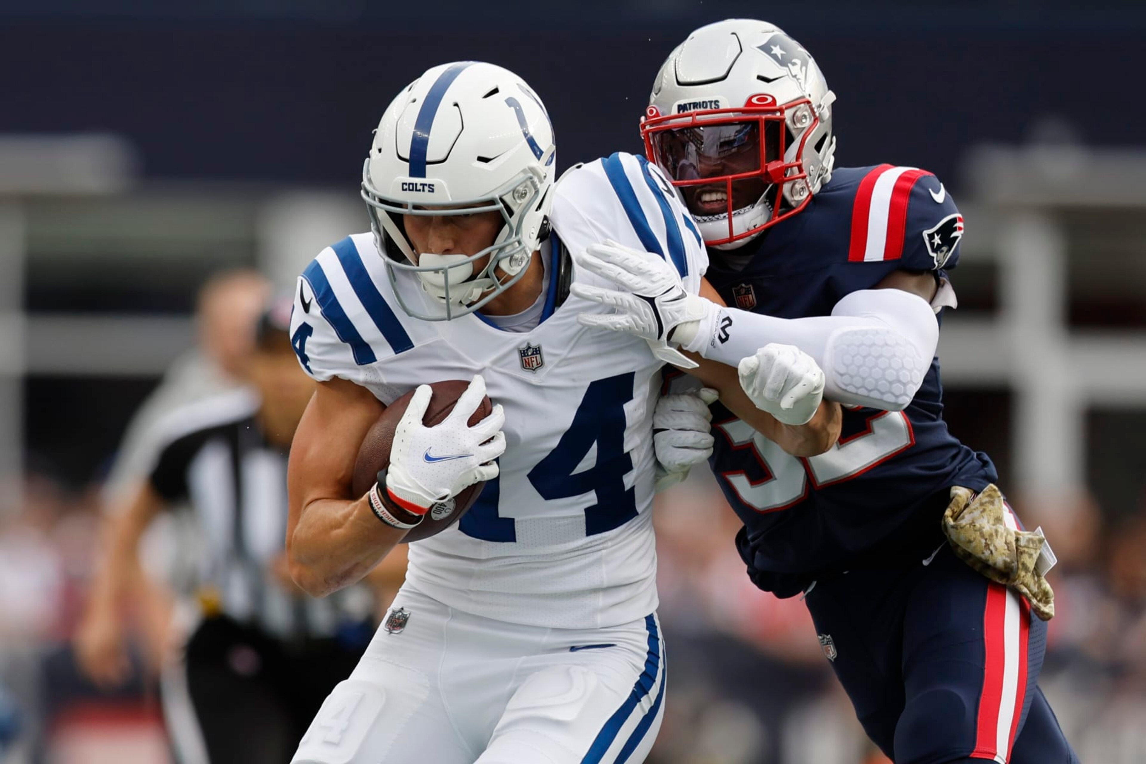Indianapolis Colts wide receiver Alec Pierce (14) is pushed out of bounds by New England Patriots safety Devin McCourty (32) in the first half of an NFL football game, Sunday, Nov. 6, 2022, in Foxborough, Mass. (AP Photo/Michael Dwyer) Indianapolis Colts wide receiver Alec Pierce (14) is pushed out of bounds by New England Patriots safety Devin McCourty (32) in the first half of an NFL football game, Sunday, Nov. 6, 2022, in Foxborough, Mass. (AP Photo/Michael Dwyer)