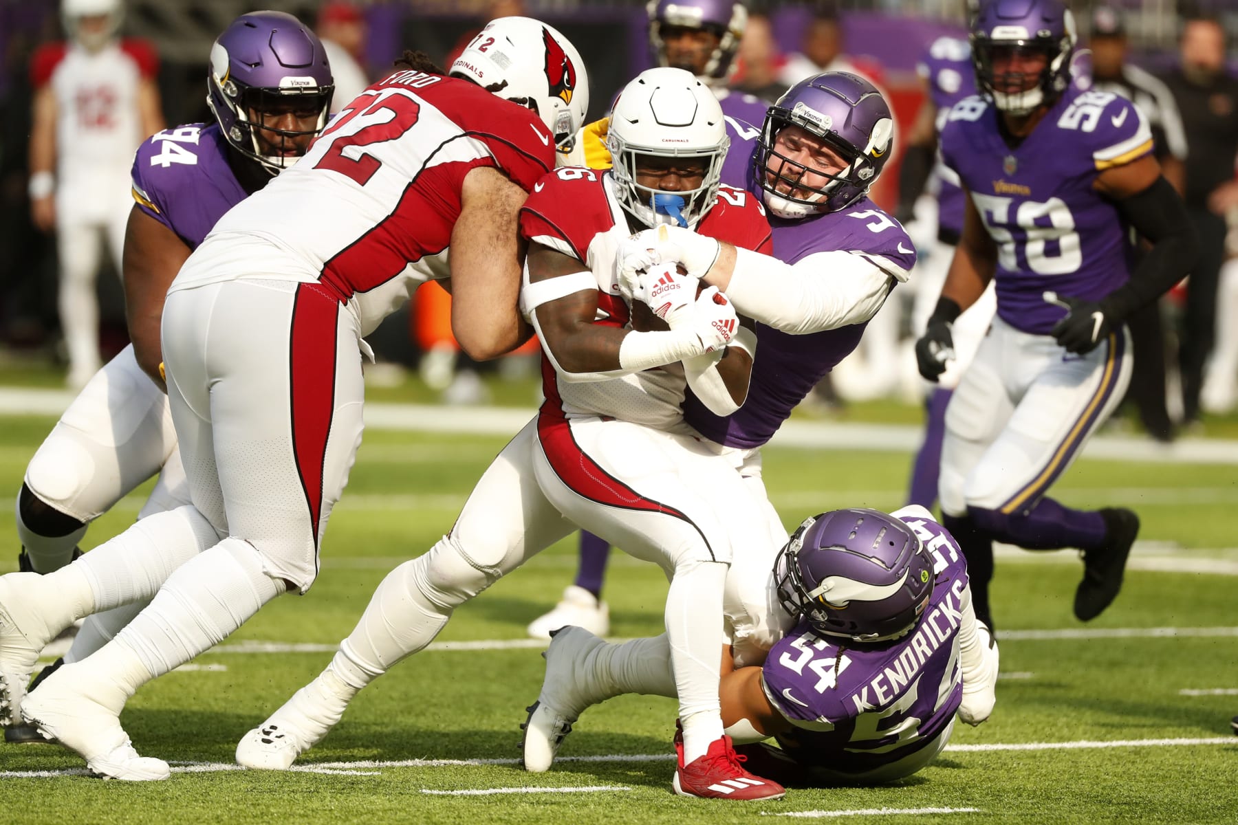Arizona Cardinals running back Eno Benjamin (26) is tackled by Minnesota Vikings defensive tackle Harrison Phillips (97) during the first half of an NFL football game, Sunday, Oct. 30, 2022, in Minneapolis. (AP Photo/Bruce Kluckhohn)