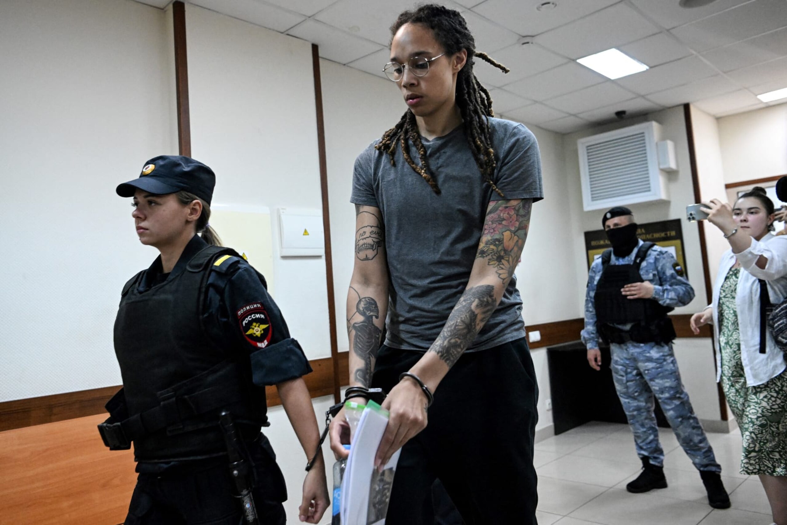 TOPSHOT - US Women National Basketball Association's (WNBA) basketball player Brittney Griner, who was detained at Moscow's Sheremetyevo airport and later charged with illegal possession of cannabis, leaves the courtroom before the court's final decision in Khimki outside Moscow, on August 4, 2022. - Russian prosecutors requested that US basketball star Brittney Griner be sentenced to nine and a half years in prison on drug smuggling charges. Her hearing comes with tensions soaring between Moscow and Washington over Russia's military intervention in Ukraine that has sparked international condemnation and a litany of Western sanctions. (Photo by Kirill KUDRYAVTSEV / POOL / AFP) (Photo by KIRILL KUDRYAVTSEV/POOL/AFP via Getty Images) TOPSHOT - US Women National Basketball Association's (WNBA) basketball player Brittney Griner, who was detained at Moscow's Sheremetyevo airport and later charged with illegal possession of cannabis, leaves the courtroom before the court's final decision in Khimki outside Moscow, on August 4, 2022. - Russian prosecutors requested that US basketball star Brittney Griner be sentenced to nine and a half years in prison on drug smuggling charges. Her hearing comes with tensions soaring between Moscow and Washington over Russia's military intervention in Ukraine that has sparked international condemnation and a litany of Western sanctions. (Photo by Kirill KUDRYAVTSEV / POOL / AFP) (Photo by KIRILL KUDRYAVTSEV/POOL/AFP via Getty Images)