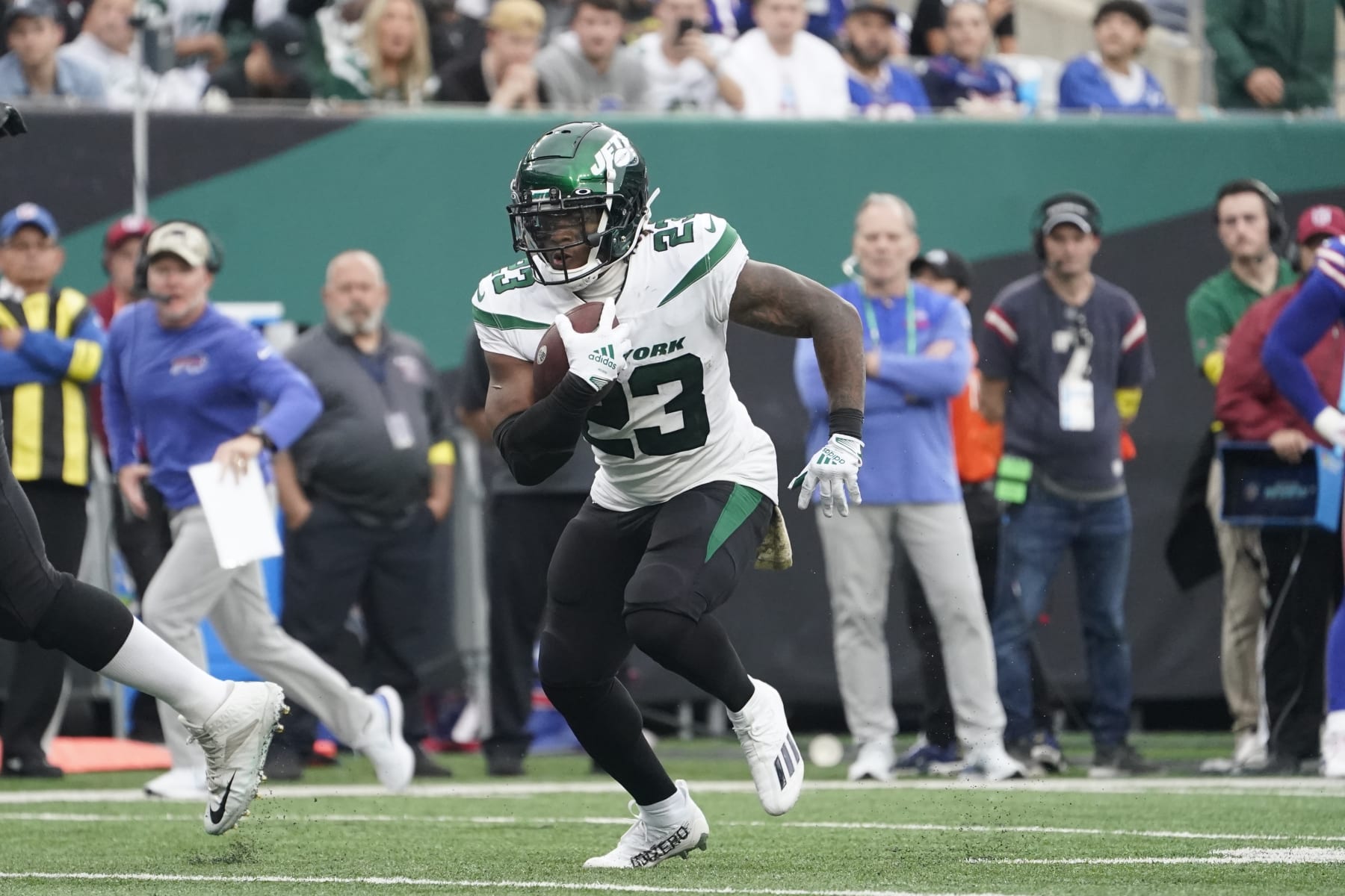 New York Jets' James Robinson (23) runs past Buffalo Bills safety Damar Hamlin (3) for a touchdown during the second half of an NFL football game, Sunday, Nov. 6, 2022, in East Rutherford, N.J. (AP Photo/John Minchillo)
