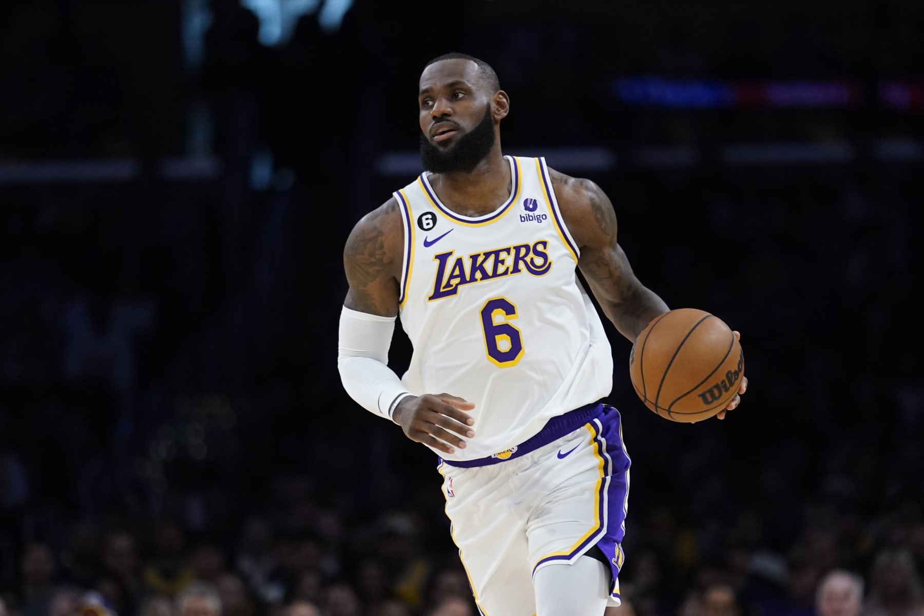 Los Angeles Lakers forward LeBron James dribbles against the Cleveland Cavaliers during the first half of an NBA basketball game Sunday, Nov. 6, 2022, in Los Angeles. (AP Photo/Marcio Jose Sanchez)