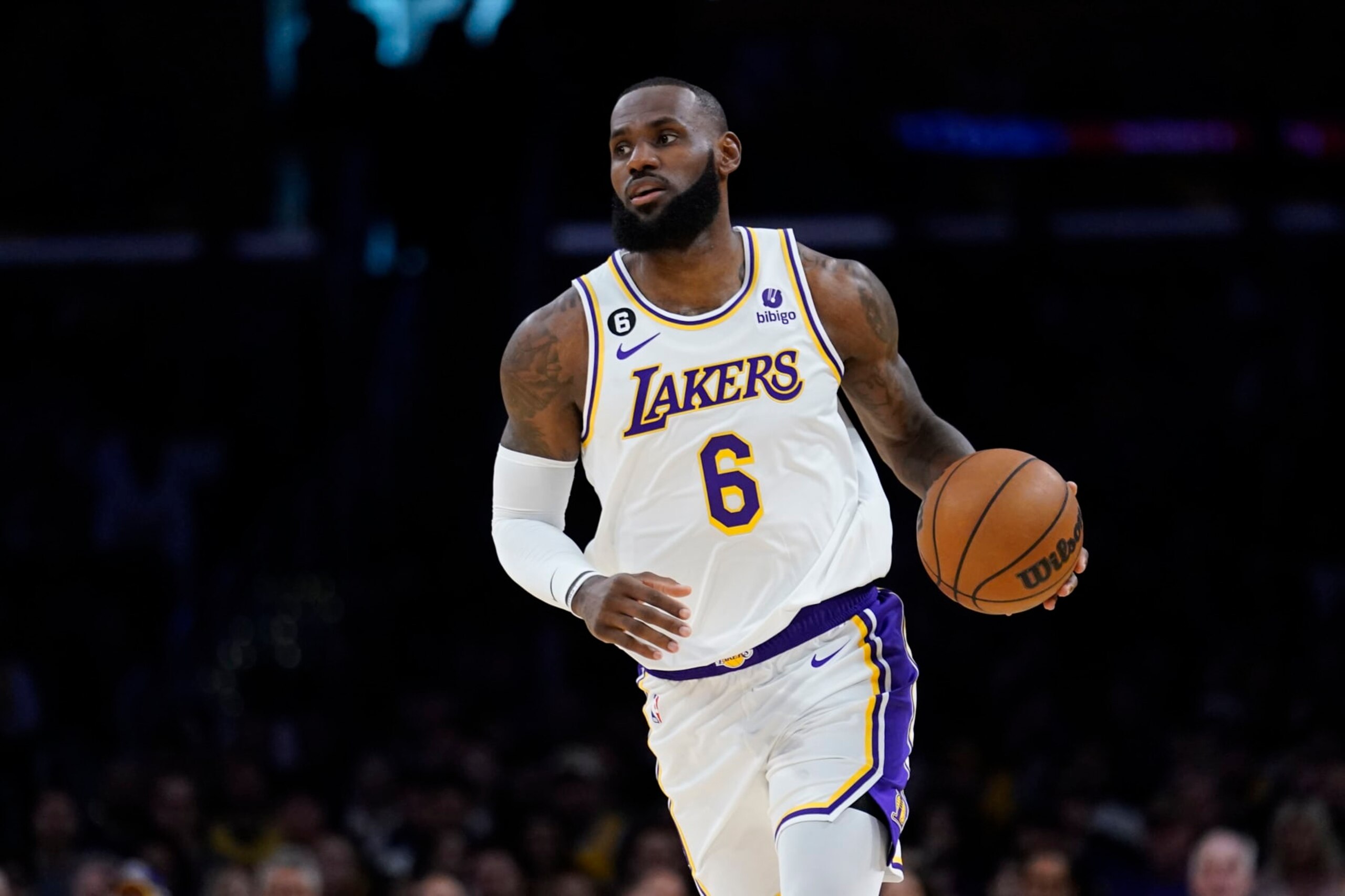 Los Angeles Lakers forward LeBron James dribbles against the Cleveland Cavaliers during the first half of an NBA basketball game Sunday, Nov. 6, 2022, in Los Angeles. (AP Photo/Marcio Jose Sanchez)