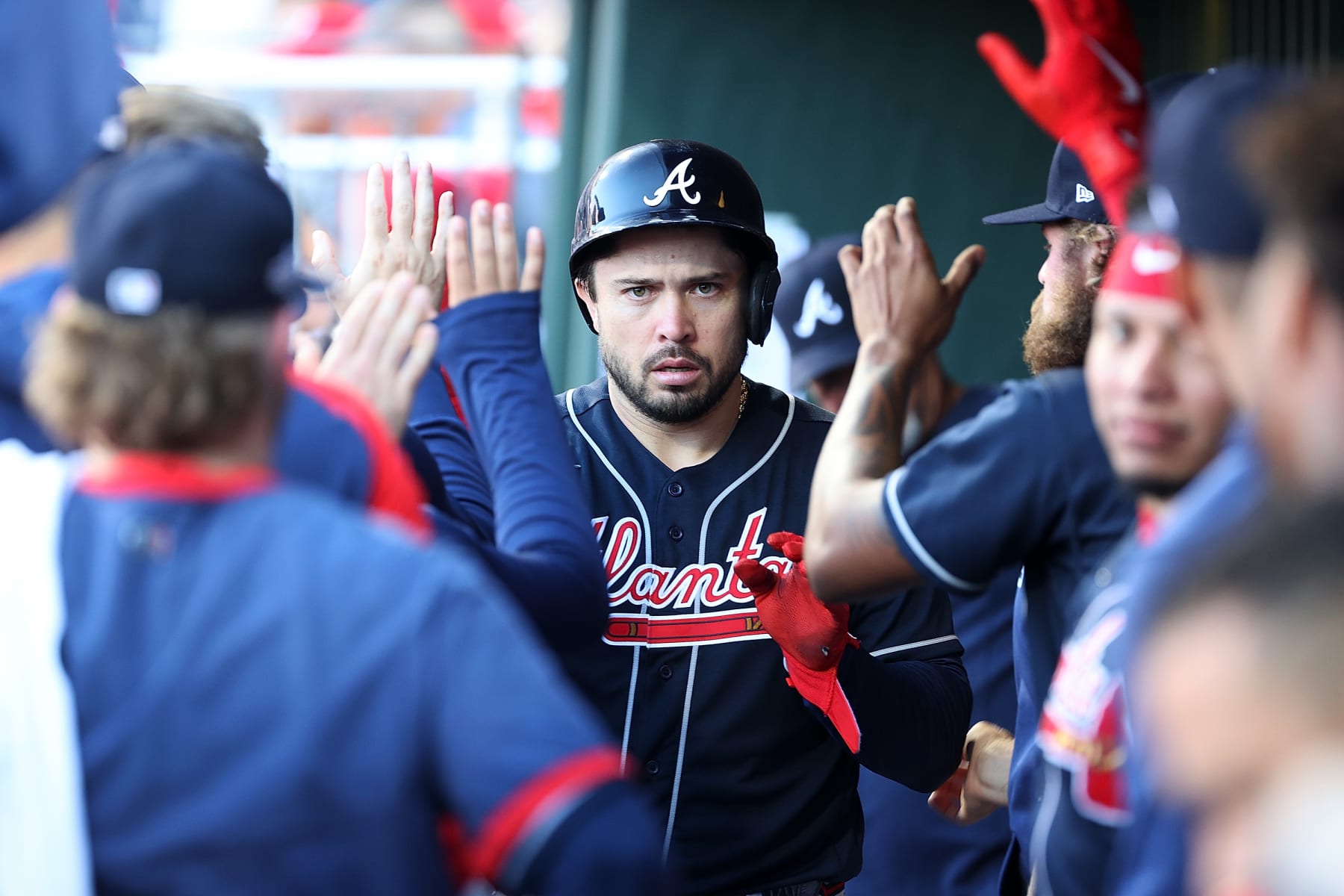 PHILADELPHIA, PENNSYLVANIA - OCTOBER 15: Travis d'Arnaud #16 of the Atlanta Braves is congratulated by teammates following a home run against the Philadelphia Phillies during the seventh inning in game four of the National League Division Series at Citizens Bank Park on October 15, 2022 in Philadelphia, Pennsylvania. (Photo by Tim Nwachukwu/Getty Images)