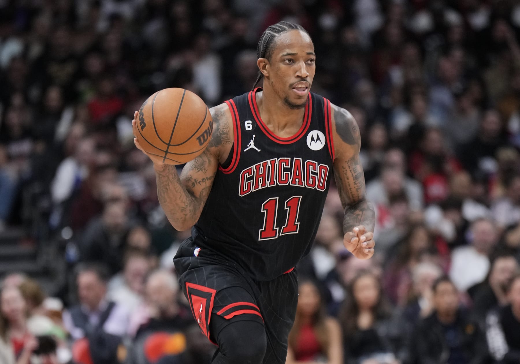 TORONTO, ON - NOVEMBER 6: DeMar DeRozan #11 of the Chicago Bulls dribbles against against the Toronto Raptors during the second half of their basketball game at the Scotiabank Arena on November 6, 2022 in Toronto, Ontario, Canada. NOTE TO USER: User expressly acknowledges and agrees that, by downloading and/or using this Photograph, user is consenting to the terms and conditions of the Getty Images License Agreement. (Photo by Mark Blinch/Getty Images)