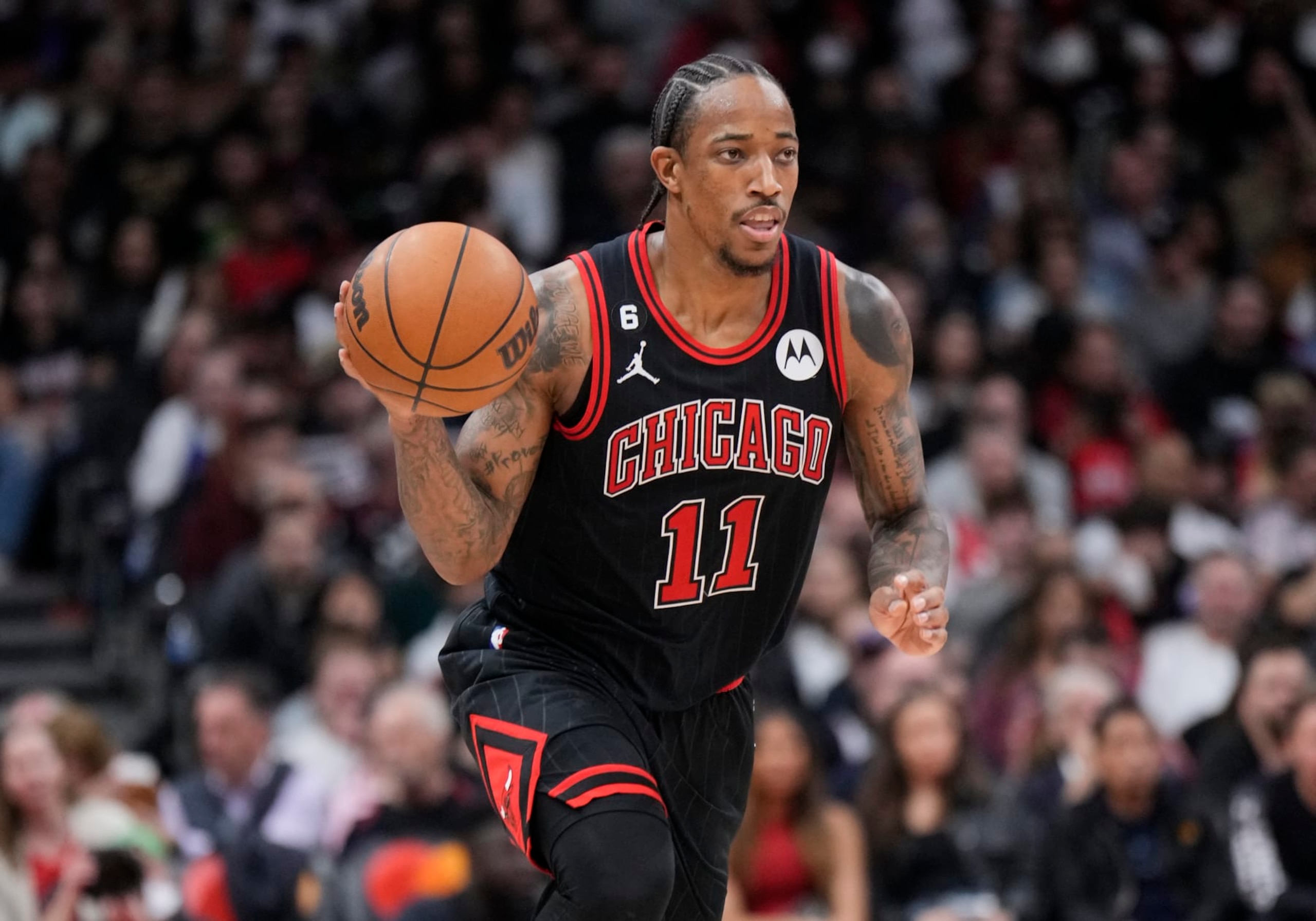 TORONTO, ON - NOVEMBER 6: DeMar DeRozan #11 of the Chicago Bulls dribbles against against the Toronto Raptors during the second half of their basketball game at the Scotiabank Arena on November 6, 2022 in Toronto, Ontario, Canada. NOTE TO USER: User expressly acknowledges and agrees that, by downloading and/or using this Photograph, user is consenting to the terms and conditions of the Getty Images License Agreement. (Photo by Mark Blinch/Getty Images)