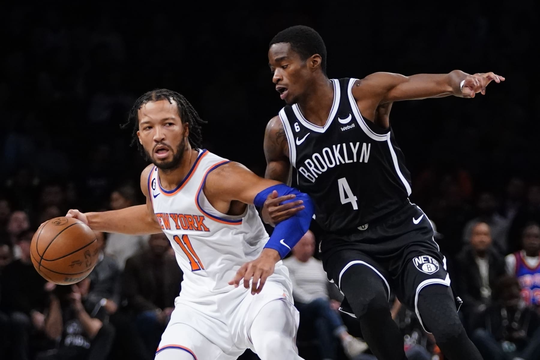 Brooklyn Nets' Edmond Sumner (4) defends New York Knicks' Jalen Brunson (11) during the first half of an NBA basketball game Wednesday, Nov. 9, 2022, in New York. (AP Photo/Frank Franklin II)