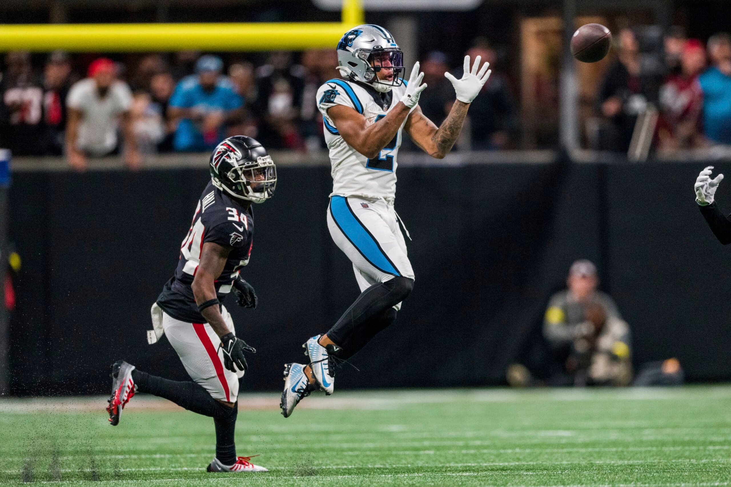 Carolina Panthers wide receiver DJ Moore (2) catches a pass in front of Atlanta Falcons cornerback Darren Hall (34) during the second half of an NFL football game, Sunday, Oct. 30, 2022, in Atlanta. The Atlanta Falcons won 37-34. (AP Photo/Danny Karnik) Carolina Panthers wide receiver DJ Moore (2) catches a pass in front of Atlanta Falcons cornerback Darren Hall (34) during the second half of an NFL football game, Sunday, Oct. 30, 2022, in Atlanta. The Atlanta Falcons won 37-34. (AP Photo/Danny Karnik)