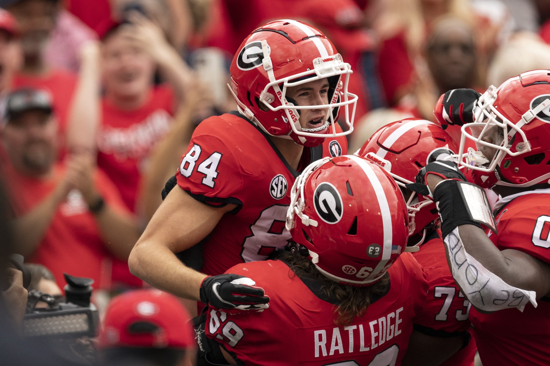 Georgia wide receiver Ladd McConkey (84) celebrates a touchdown catch with teammates during the first half of an NCAA college football game against Tennessee, Saturday, Nov. 5, 2022, in Athens, Ga. (AP Photo/John Bazemore)
