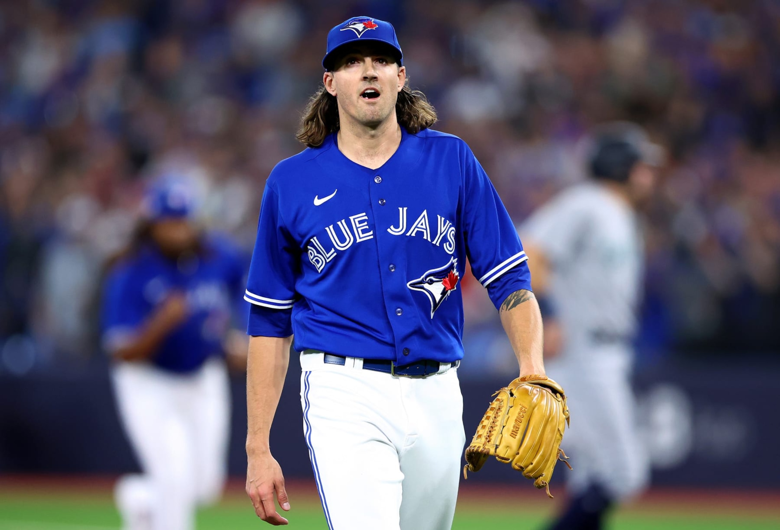 TORONTO, ONTARIO - OCTOBER 08: Kevin Gausman #34 of the Toronto Blue Jays reacts after closing out the top of the first inning against the Seattle Mariners in game two of the American League Wild Card Series at Rogers Centre on October 08, 2022 in Toronto, Ontario. (Photo by Vaughn Ridley/Getty Images)