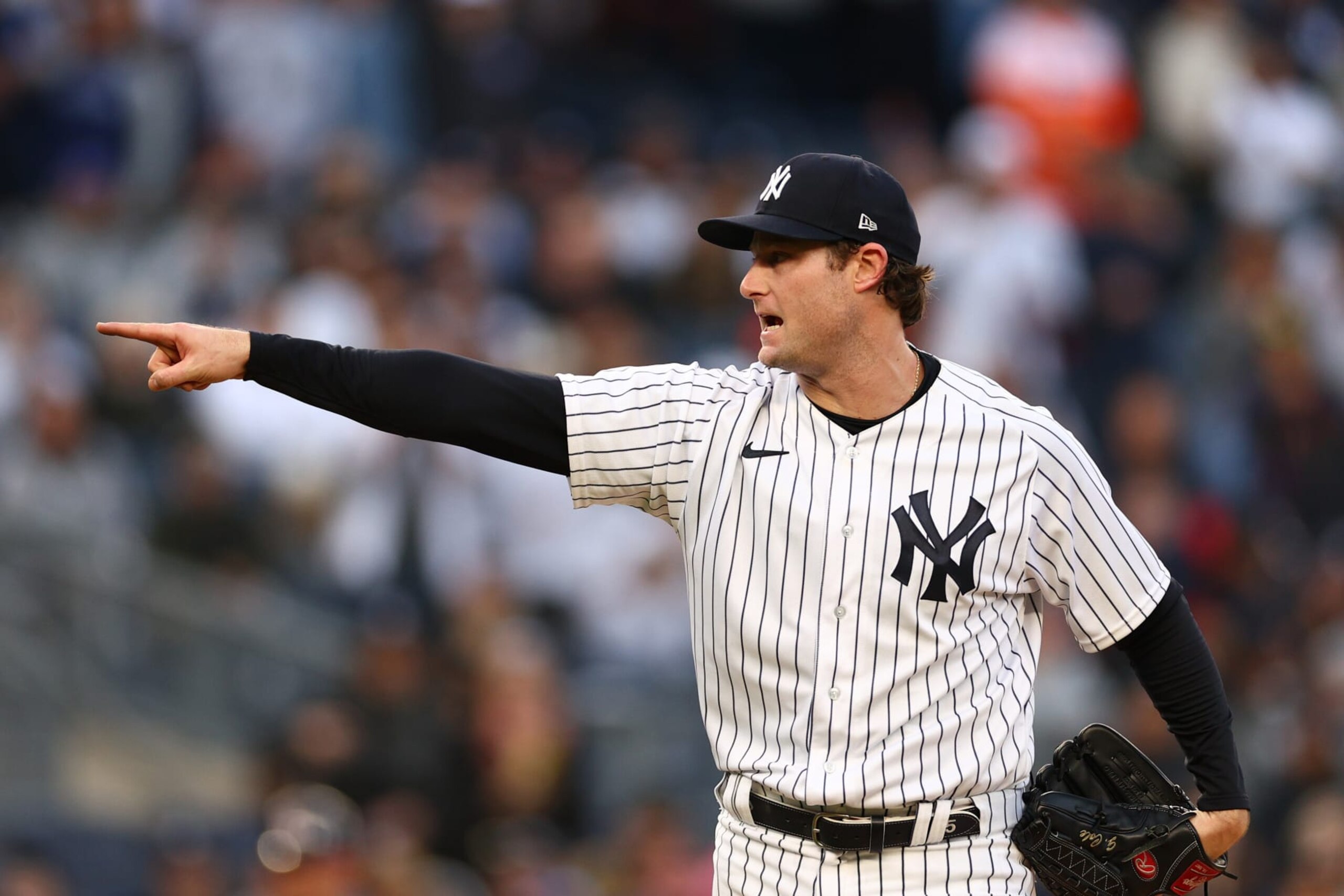 NEW YORK, NEW YORK - OCTOBER 22: Gerrit Cole #45 of the New York Yankees reacts after striking out Jose Altuve #27 of the Houston Astros during the first inning in game three of the American League Championship Series at Yankee Stadium on October 22, 2022 in New York City. (Photo by Elsa/Getty Images)