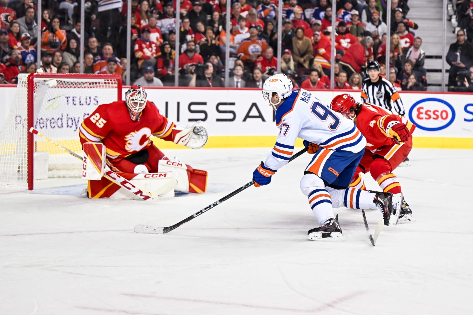 Calgary Flames goaltender Jacob Markström (left) faces Edmonton Oilers center Connor McDavid. 