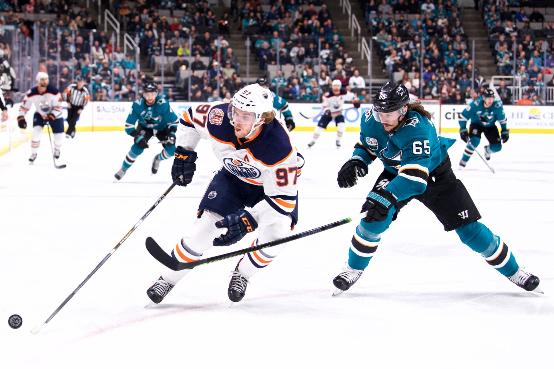 Edmonton Oilers center Connor McDavid (left) and San Jose Sharks defenseman Erik Karlsson.