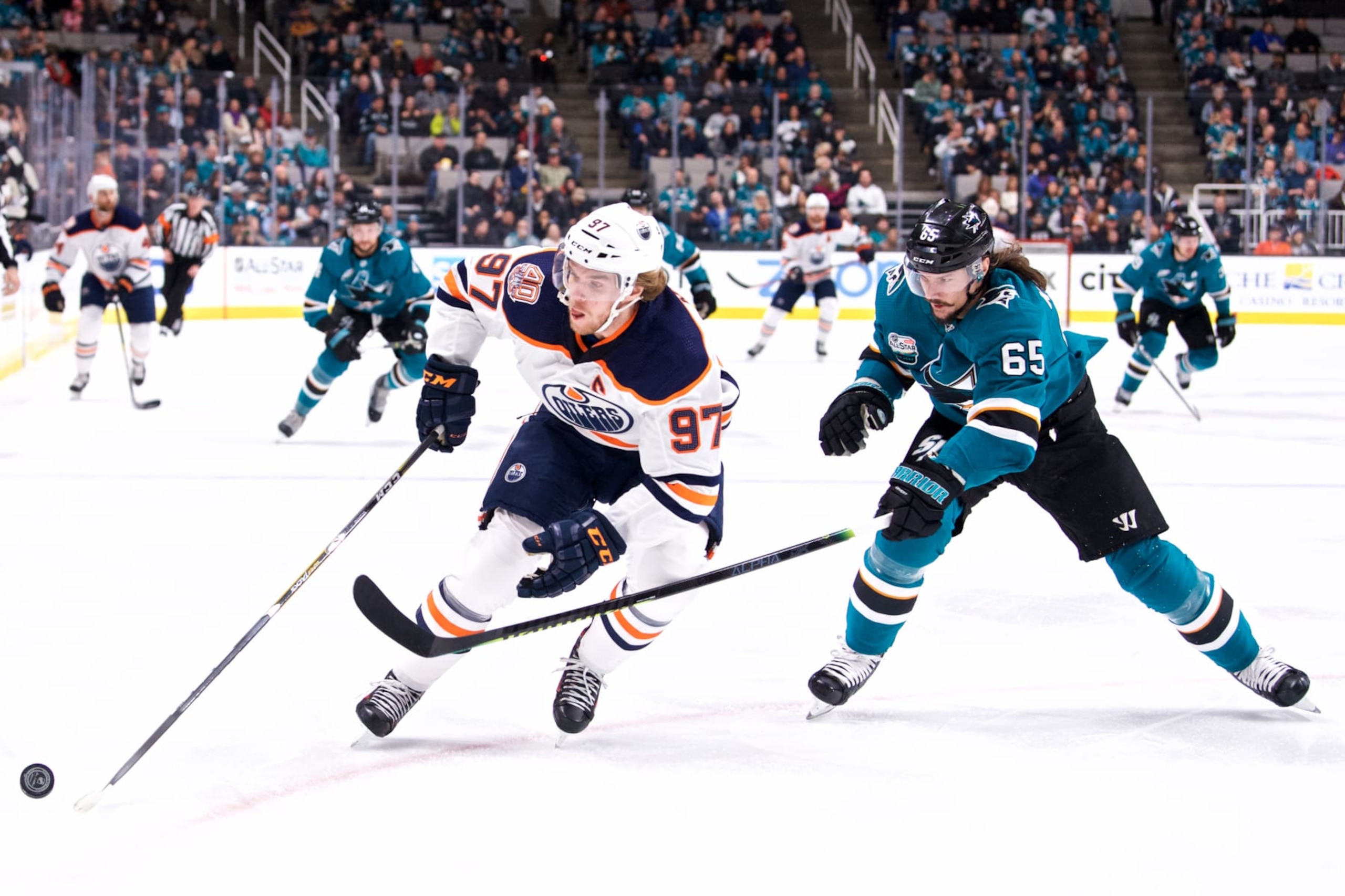 Edmonton Oilers center Connor McDavid (left) and San Jose Sharks defenseman Erik Karlsson.