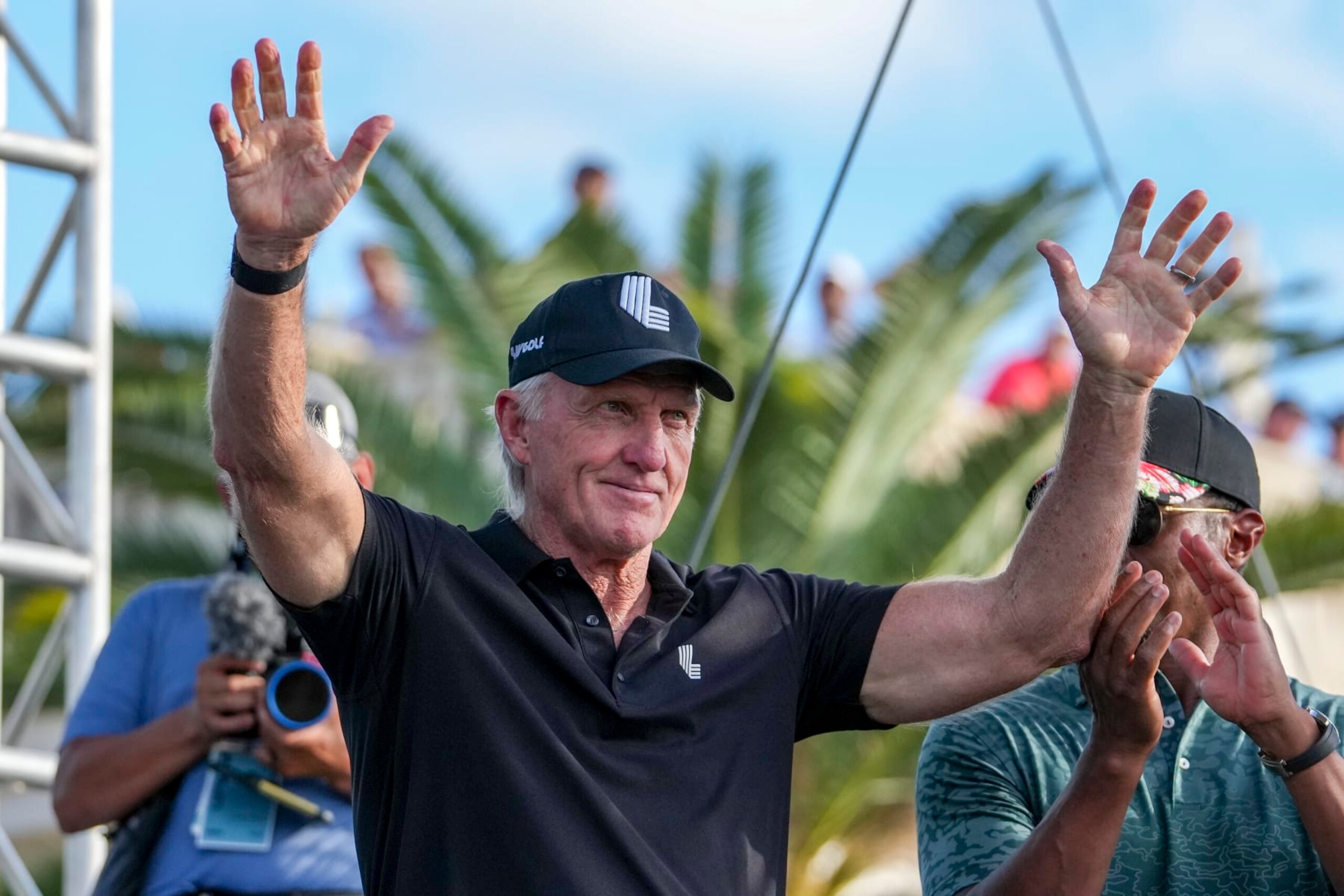 DORAL, FL - OCTOBER 30: Greg Norman, CEO and commissioner of LIV Golf, waves as being introduced to the crowd during the team championship stroke-play round of the LIV Golf Invitational - Miami at Trump National Doral Miami on October 30, 2022 in Doral, Florida. (Photo by Eric Espada/Getty Images)