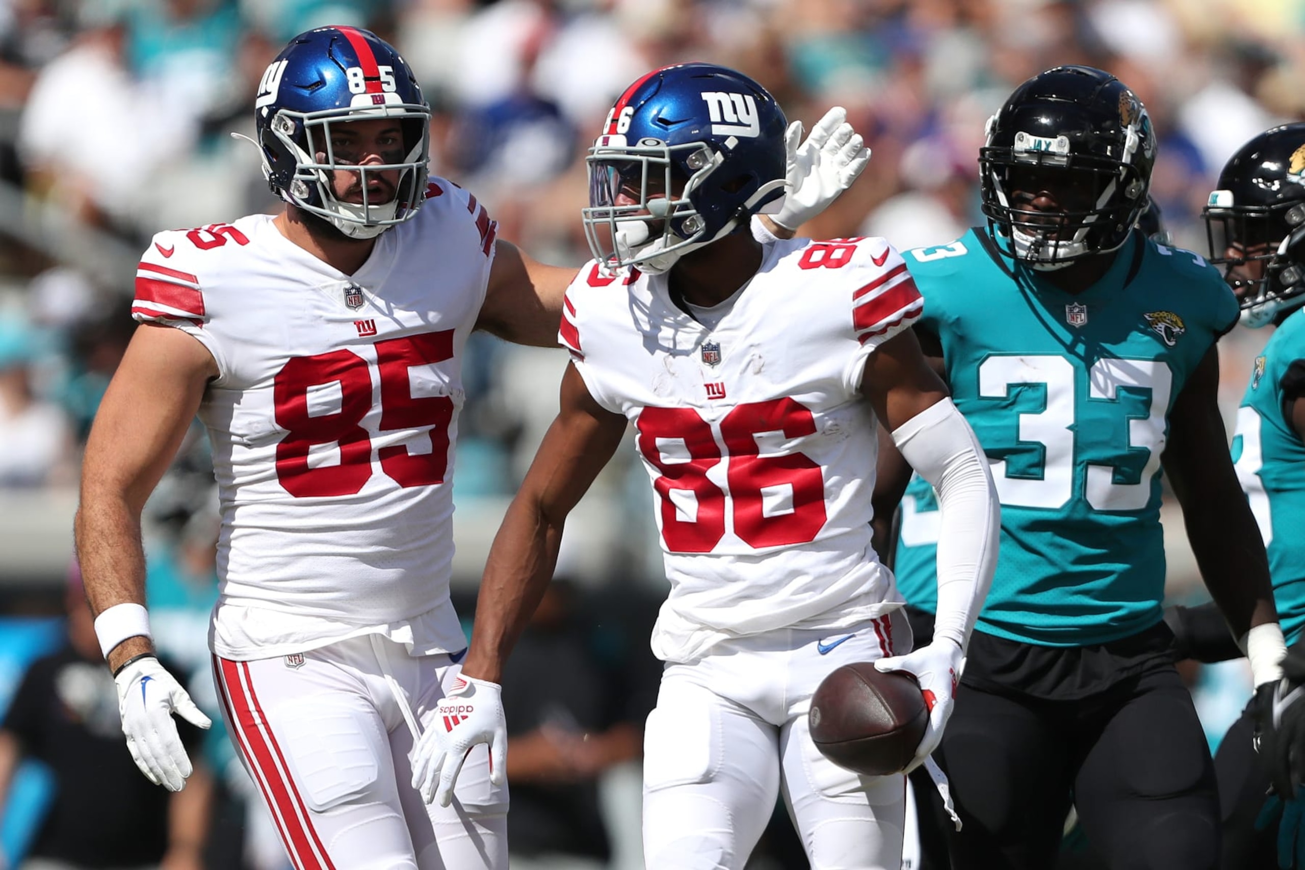 JACKSONVILLE, FLORIDA - OCTOBER 23: Darius Slayton #86 of the New York Giants reacts after catching a pass during the first half against the Jacksonville Jaguars at TIAA Bank Field on October 23, 2022 in Jacksonville, Florida. (Photo by Courtney Culbreath/Getty Images)