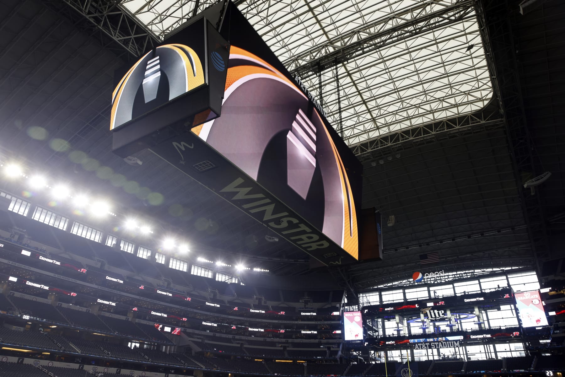 The CFP logo is displayed before the Cotton Bowl NCAA College Football Playoff semifinal game, Friday, Dec. 31, 2021, in Arlington, Texas. (AP Photo/Michael Ainsworth)