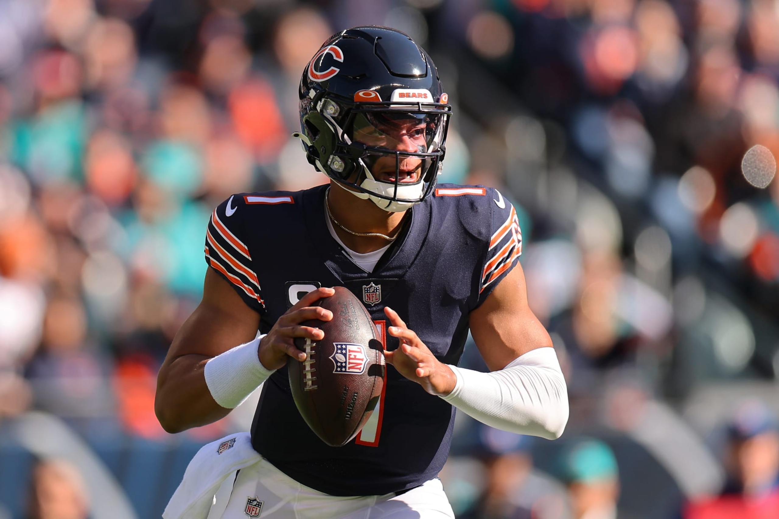 CHICAGO, ILLINOIS - NOVEMBER 06: Justin Fields #1 of the Chicago Bears in action against the Miami Dolphins at Soldier Field on November 06, 2022 in Chicago, Illinois. (Photo by Michael Reaves/Getty Images) CHICAGO, ILLINOIS - NOVEMBER 06: Justin Fields #1 of the Chicago Bears in action against the Miami Dolphins at Soldier Field on November 06, 2022 in Chicago, Illinois. (Photo by Michael Reaves/Getty Images)