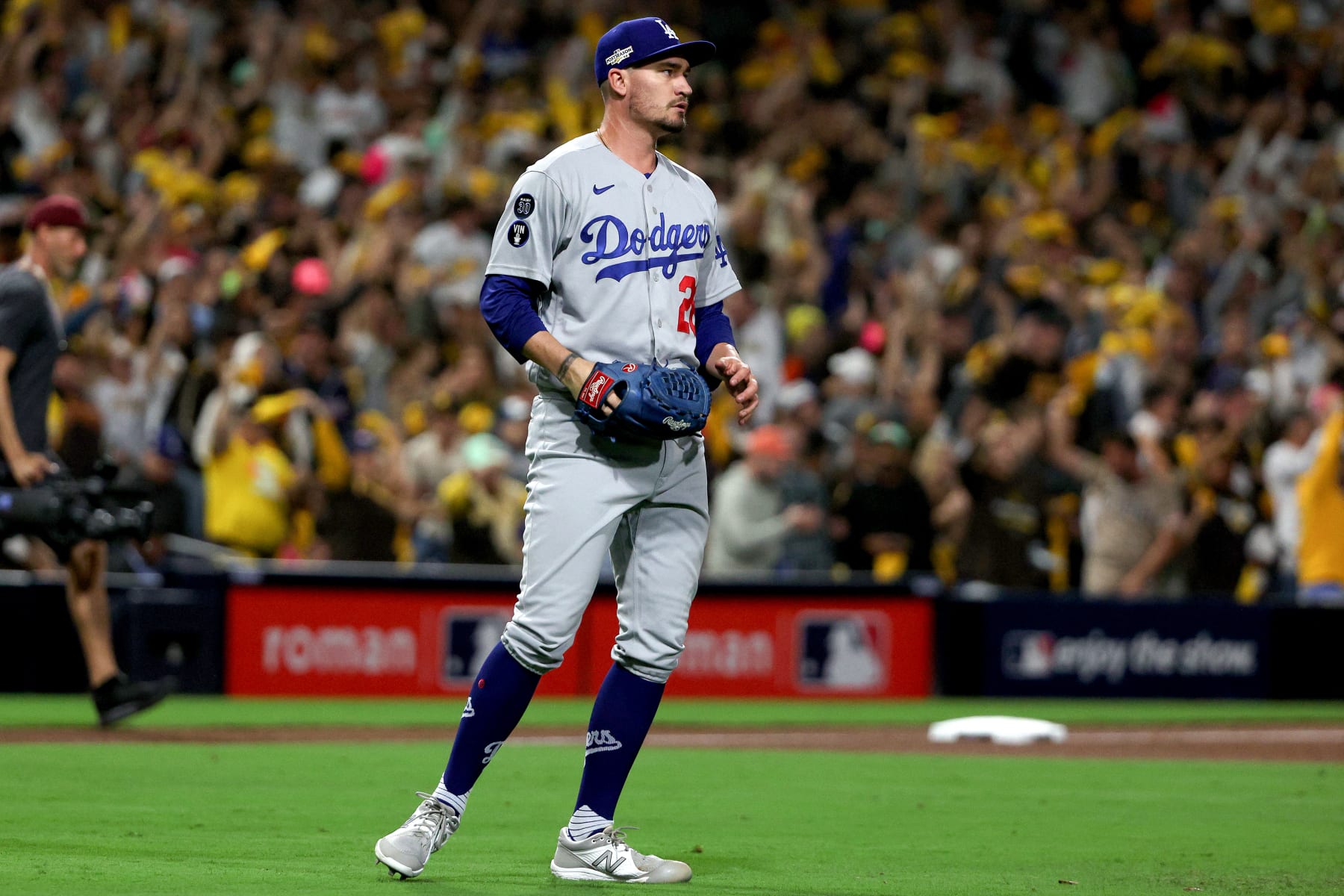 SAN DIEGO, CALIFORNIA - OCTOBER 14: Andrew Heaney #28 of the Los Angeles Dodgers reacts after a home run by Trent Grisham #2 of the San Diego Padres during the fourth inning in game three of the National League Division Series at PETCO Park on October 14, 2022 in San Diego, California. (Photo by Harry How/Getty Images)