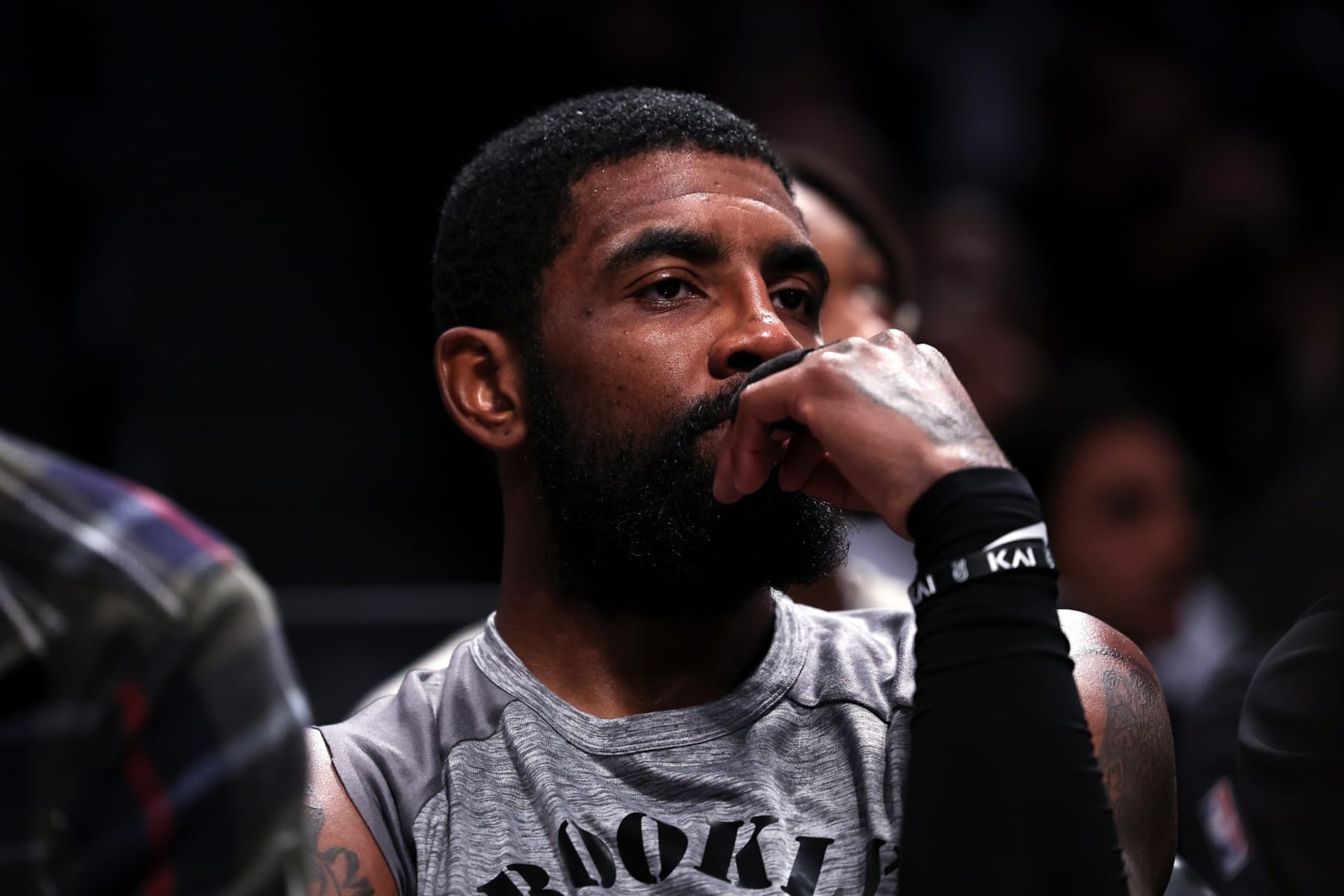 NEW YORK, NEW YORK - NOVEMBER 01: Kyrie Irving #11 of the Brooklyn Nets looks on from the bench during the second quarter of the game against the Chicago Bulls at Barclays Center on November 01, 2022 in New York City. NOTE TO USER: User expressly acknowledges and agrees that, by downloading and or using this photograph, User is consenting to the terms and conditions of the Getty Images License Agreement. (Photo by Dustin Satloff/Getty Images) NEW YORK, NEW YORK - NOVEMBER 01: Kyrie Irving #11 of the Brooklyn Nets looks on from the bench during the second quarter of the game against the Chicago Bulls at Barclays Center on November 01, 2022 in New York City. NOTE TO USER: User expressly acknowledges and agrees that, by downloading and or using this photograph, User is consenting to the terms and conditions of the Getty Images License Agreement. (Photo by Dustin Satloff/Getty Images)
