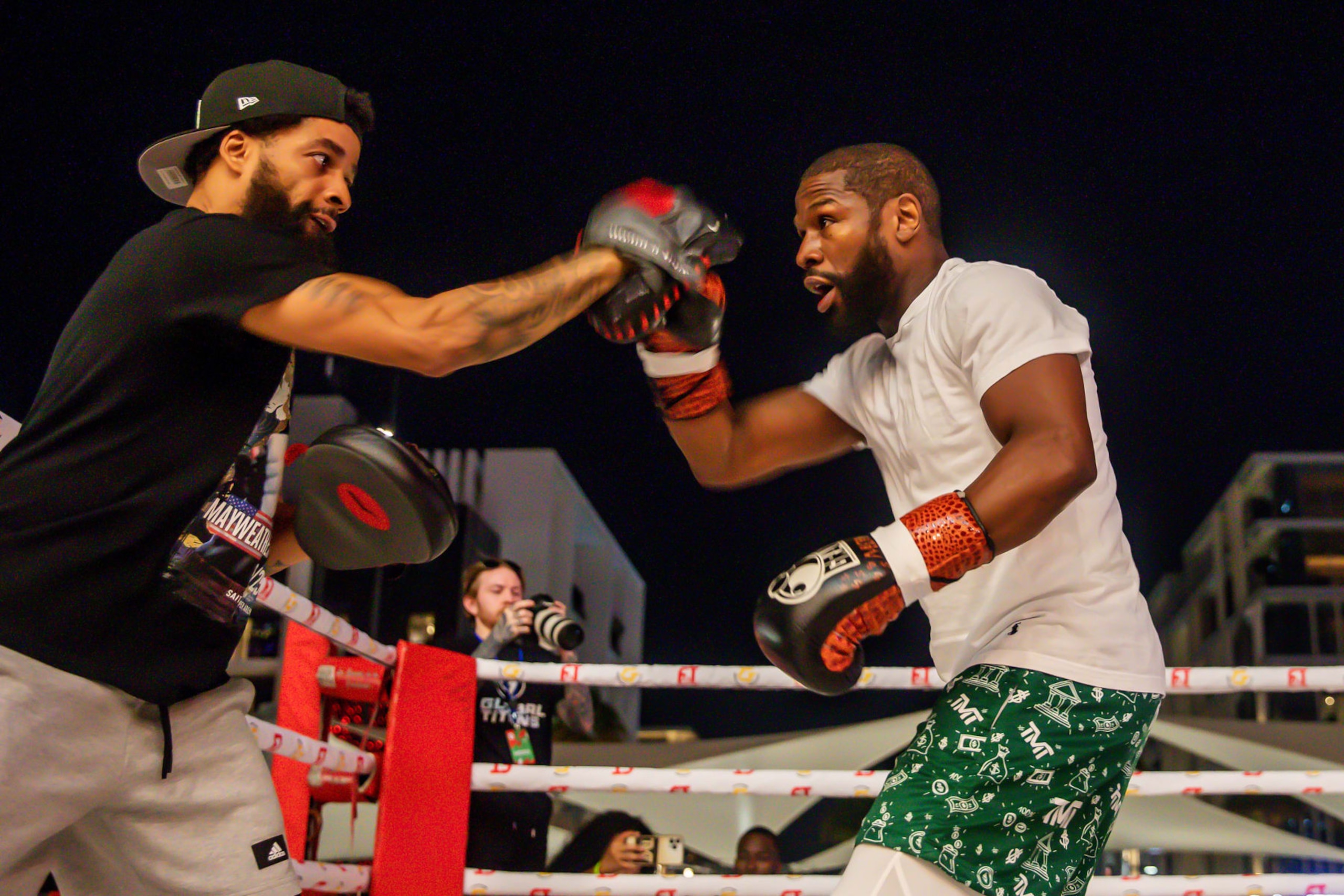 Floyd Mayweather works the mitts ahead of the exhibition bout. Floyd Mayweather works the mitts ahead of the exhibition bout.