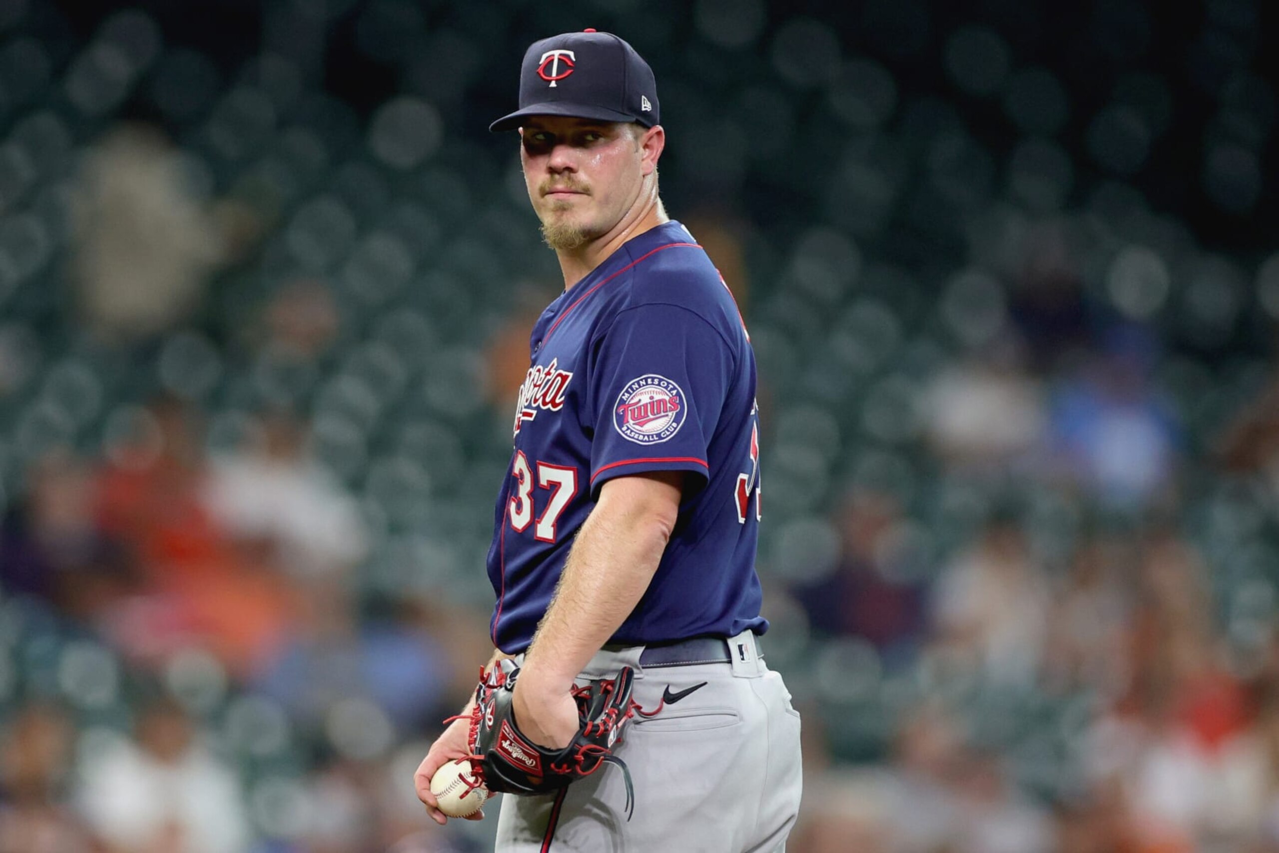 HOUSTON, TEXAS - AUGUST 24: Dylan Bundy #37 of the Minnesota Twins glances at first base during the first inning against the Houston Astros at Minute Maid Park on August 24, 2022 in Houston, Texas. (Photo by Carmen Mandato/Getty Images) HOUSTON, TEXAS - AUGUST 24: Dylan Bundy #37 of the Minnesota Twins glances at first base during the first inning against the Houston Astros at Minute Maid Park on August 24, 2022 in Houston, Texas. (Photo by Carmen Mandato/Getty Images)