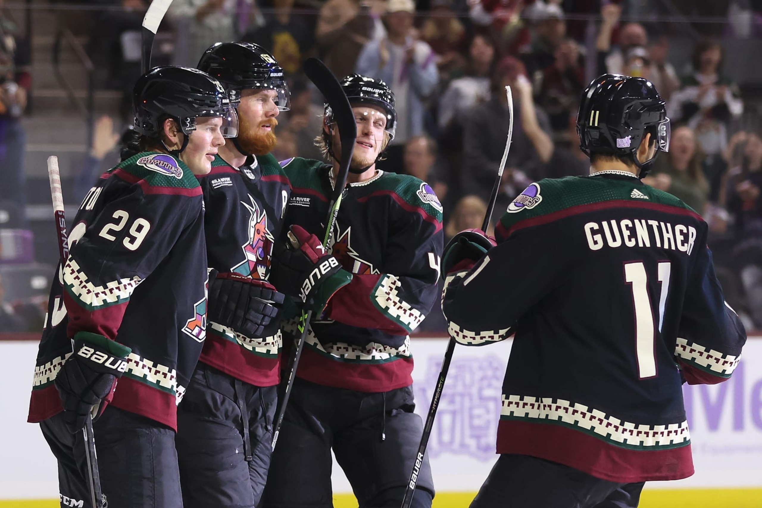 TEMPE, ARIZONA - NOVEMBER 01: (L-R) Barrett Hayton #29, Lawson Crouse #67, Juuso Valimaki #4 and Dylan Guenther #11 of the Arizona Coyotes celebrate after Crouse scored a power-play goal against the Florida Panthersduring the second period of the NHL game at Mullett Arena on November 01, 2022 in Tempe, Arizona. (Photo by Christian Petersen/Getty Images)