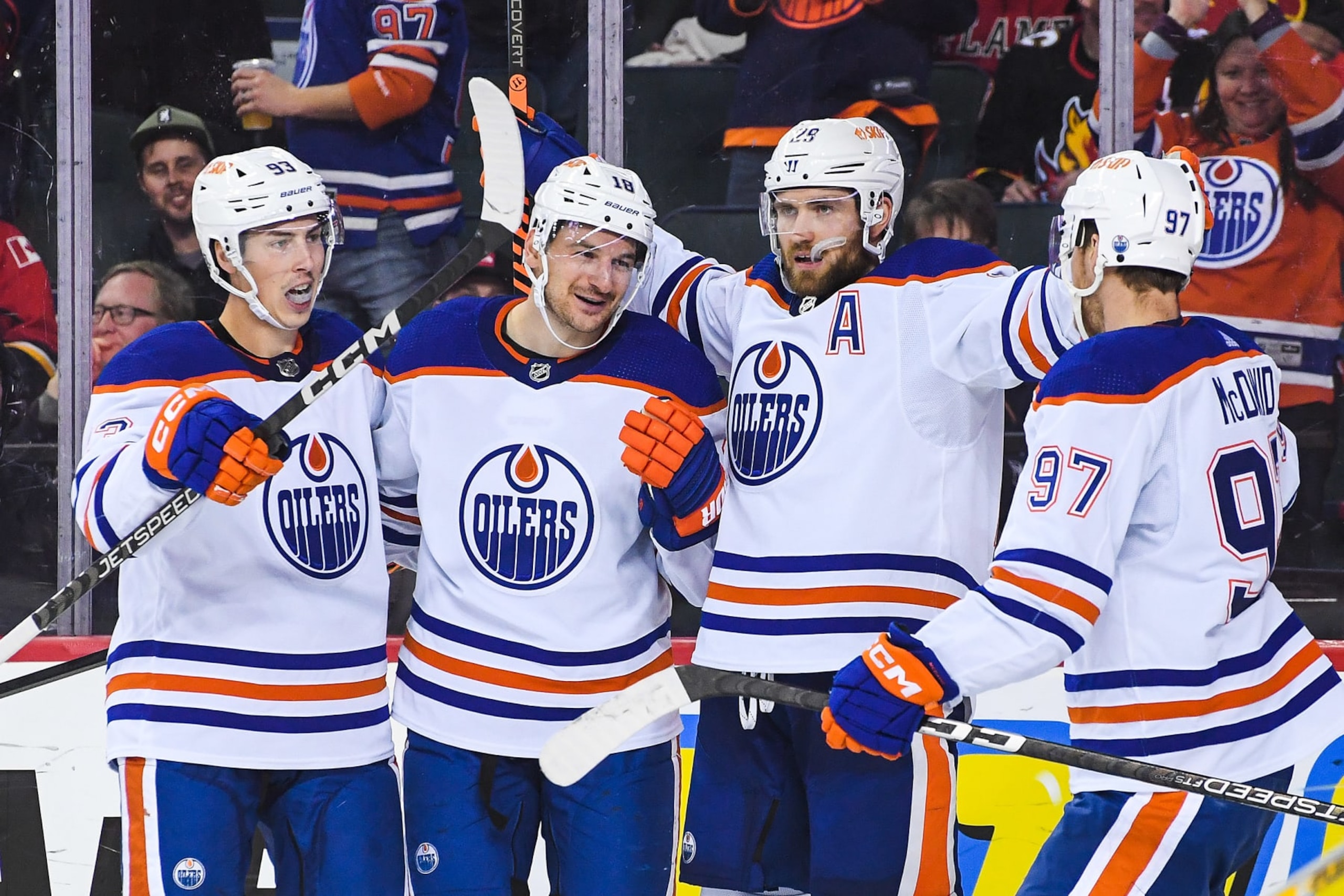 CALGARY, CANADA - OCTOBER 29: (L to R) Ryan Nugent-Hopkins #93, Zach Hyman #18, Leon Draisaitl #29 and Connor McDavid #97 of the Edmonton Oilers celebrate after Hyman scored against the Calgary Flames during the second period of an NHL game at Scotiabank Saddledome on October 29, 2022 in Calgary, Alberta, Canada. (Photo by Derek Leung/Getty Images)