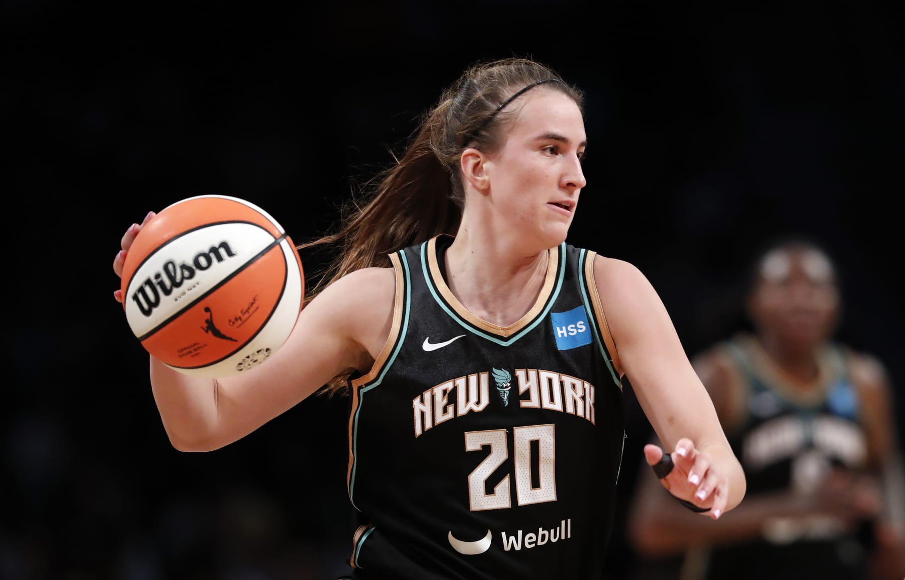 New York Liberty guard Sabrina Ionescu (20) dribbles the ball against the Chicago Sky during the first half of a WNBA basketball playoff game Tuesday, Aug. 23, 2022, in New York. (AP Photo/Noah K. Murray)