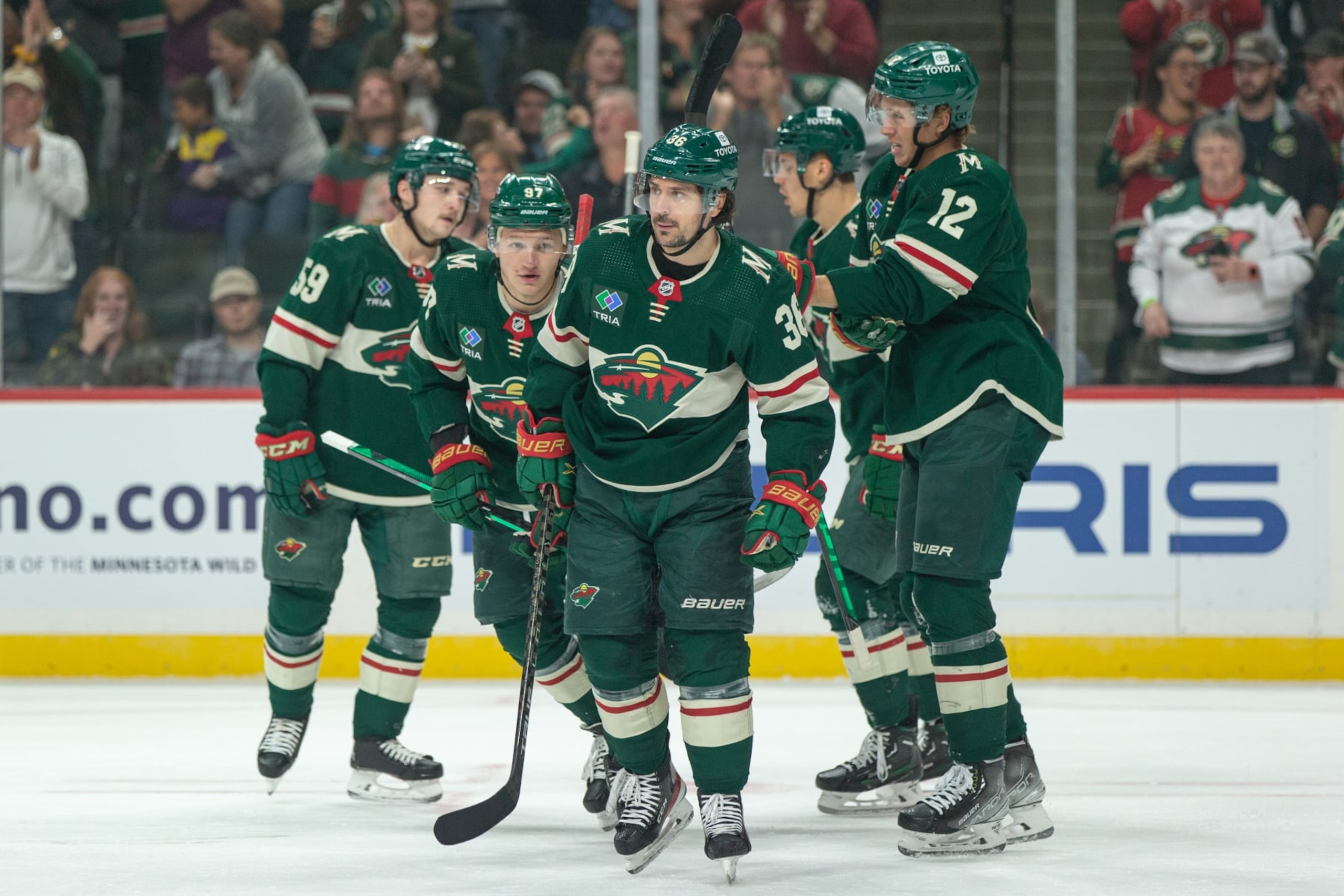 SAINT PAUL, MN - OCTOBER 08: Minnesota Wild Right Wing Mats Zuccarello (36) celebrates with teammates after a Minnesota goal during the NHL game between the Dallas Stars and Minnesota Wild, on October 8th, 2022, at Xcel Energy Center in Saint Paul, MN. (Photo by Bailey Hillesheim/Icon Sportswire via Getty Images)