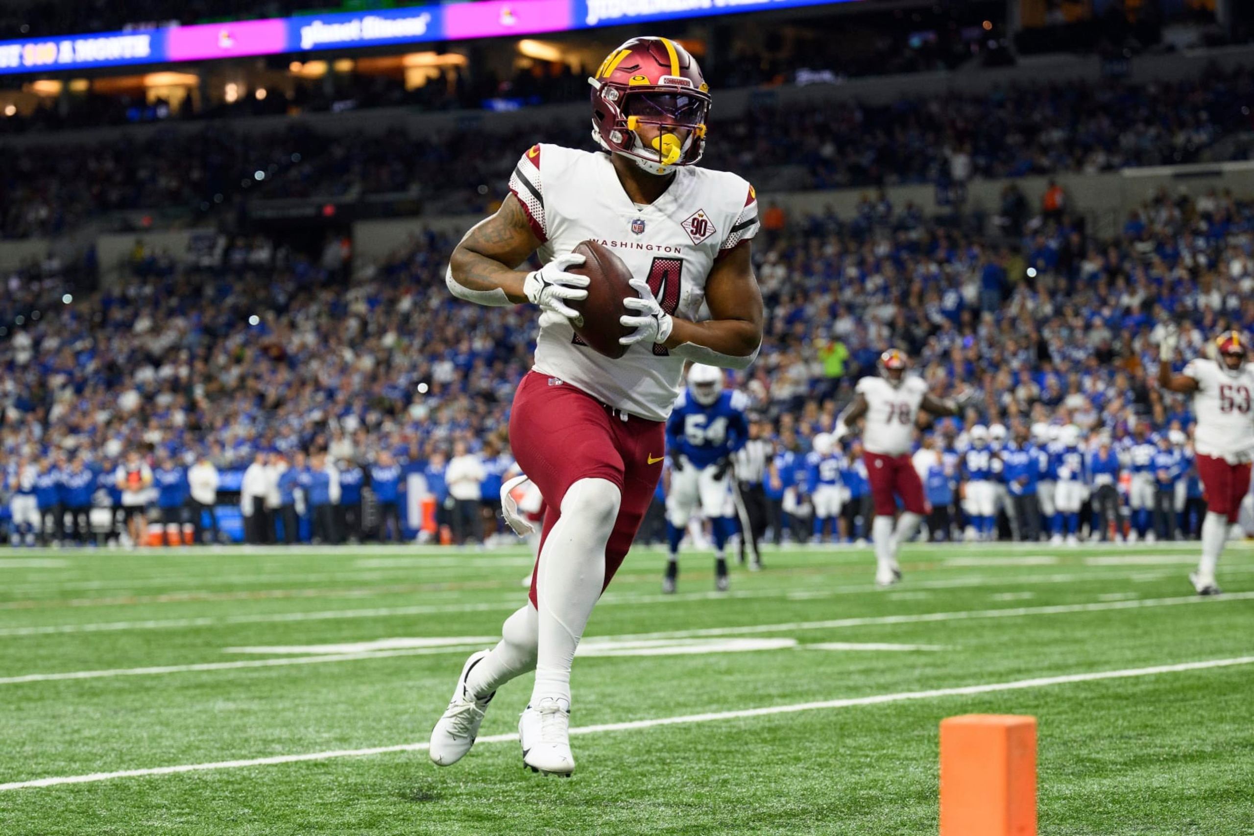 Washington Commanders running back Antonio Gibson (24) scores a touchdown on a run to the outside during an NFL football game against the Indianapolis Colts, Sunday, Oct. 30, 2022, in Indianapolis. (AP Photo/Zach Bolinger) Washington Commanders running back Antonio Gibson (24) scores a touchdown on a run to the outside during an NFL football game against the Indianapolis Colts, Sunday, Oct. 30, 2022, in Indianapolis. (AP Photo/Zach Bolinger)