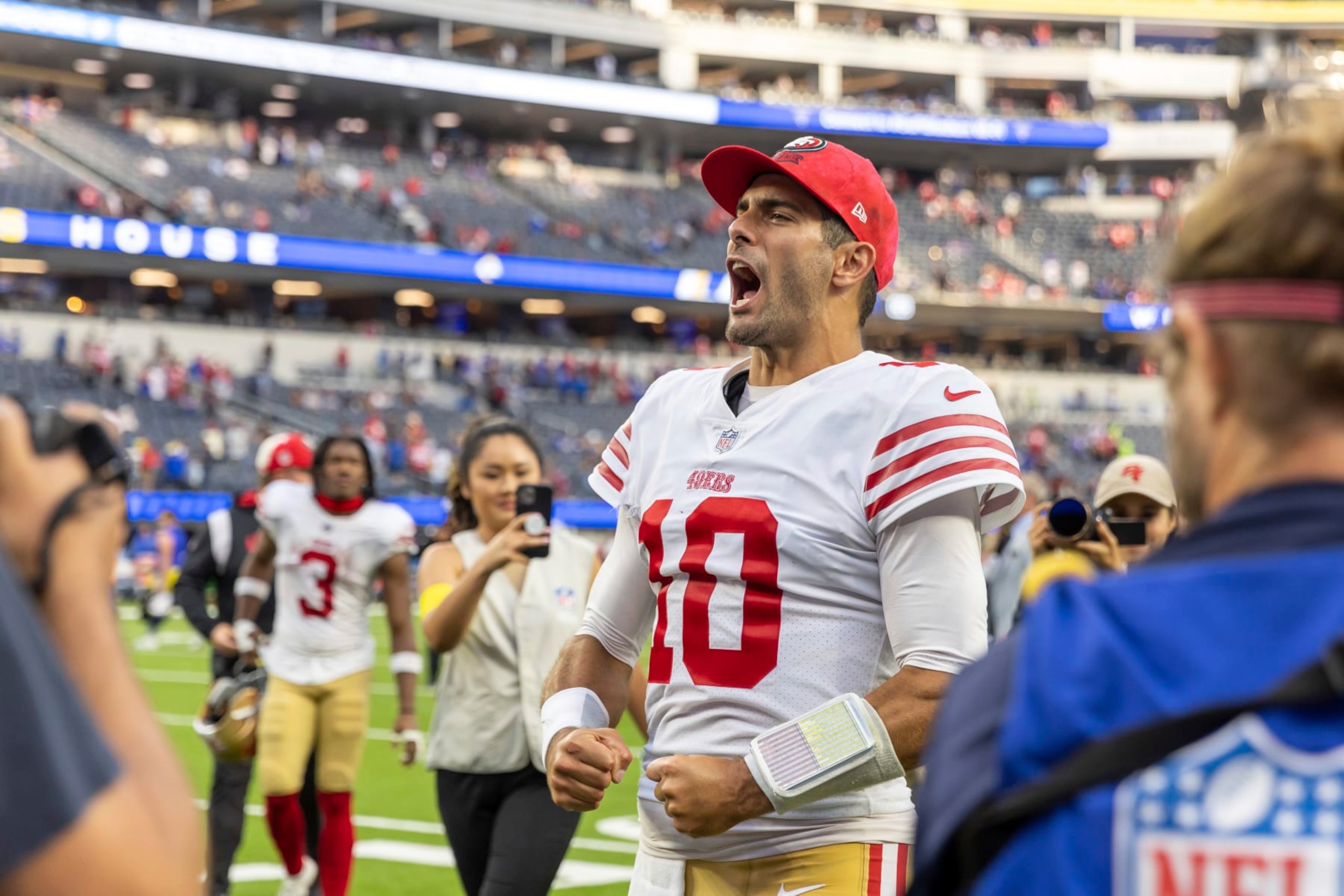 San Francisco 49ers quarterback Jimmy Garoppolo (10) celebrates after the 49ers defeat the Los Angeles Rams 31-14 in an NFL football game, Sunday, Oct. 30, 2022, in Inglewood, Calif. (AP Photo/Jeff Lewis) San Francisco 49ers quarterback Jimmy Garoppolo (10) celebrates after the 49ers defeat the Los Angeles Rams 31-14 in an NFL football game, Sunday, Oct. 30, 2022, in Inglewood, Calif. (AP Photo/Jeff Lewis)