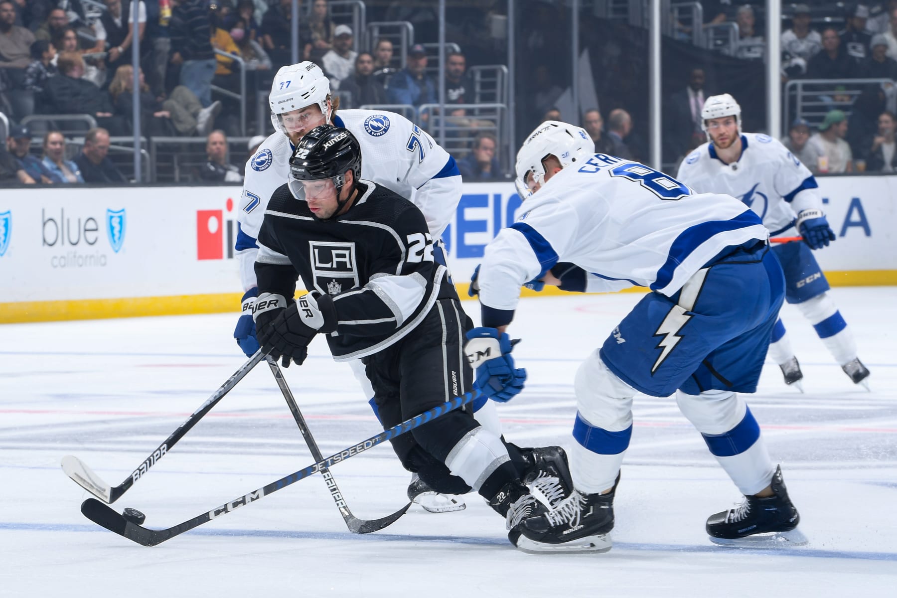Tampa Bay Lightning defensemen Victor Hedman and Erik Cernak attempt to contain Los Angeles Kings winger Kevin Fiala.