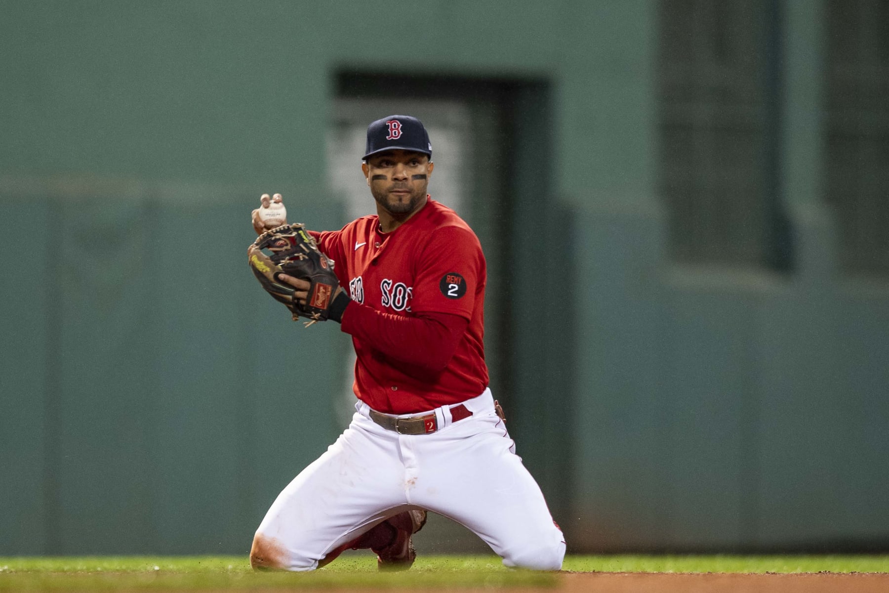 BOSTON, MA - OCTOBER 5: Xander Bogaerts #2 of the Boston Red Sox throws from his knees to begin a double play during the sixth inning of a game against the Tampa Bay Rays on October 5, 2022 at Fenway Park in Boston, Massachusetts. (Photo by Billie Weiss/Boston Red Sox/Getty Images)