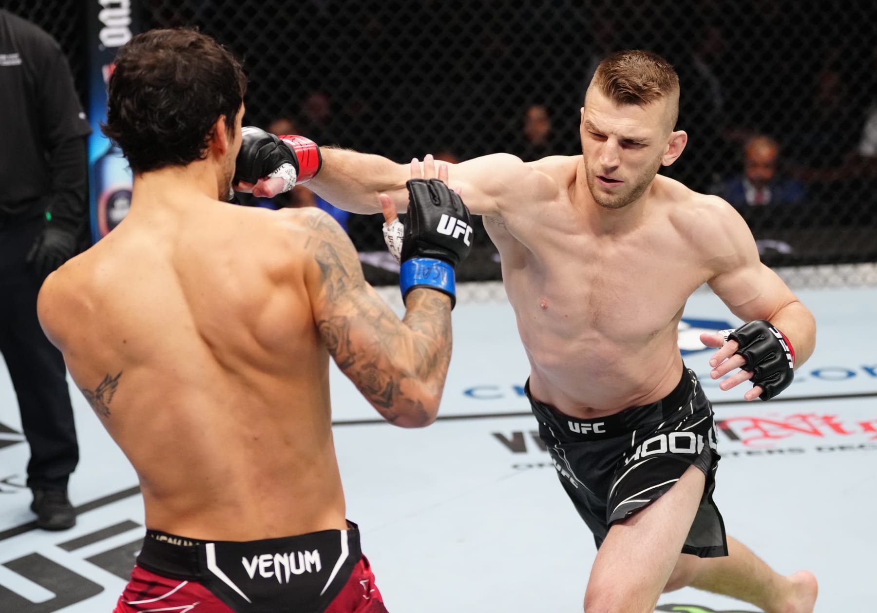 NEW YORK, NEW YORK - NOVEMBER 12: (R-L) Dan Hooker of New Zealand punches Claudio Puelles of Peru in a lightweight bout during the UFC 281 event at Madison Square Garden on November 12, 2022 in New York City. (Photo by Jeff Bottari/Zuffa LLC)