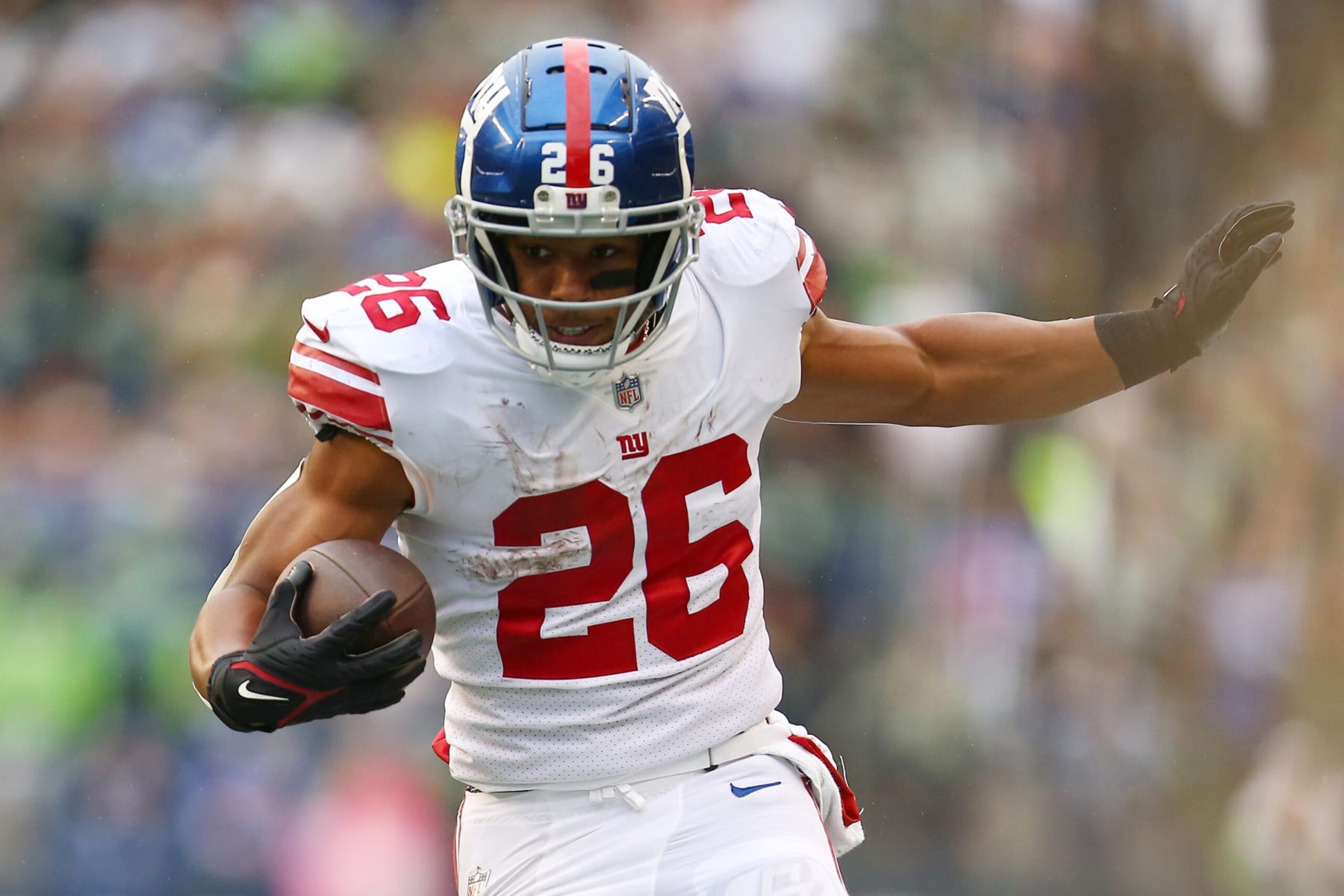 SEATTLE, WASHINGTON - OCTOBER 30: Saquon Barkley #26 of the New York Giants runs against the Seattle Seahawks during the second half at Lumen Field on October 30, 2022 in Seattle, Washington. (Photo by Lindsey Wasson/Getty Images) SEATTLE, WASHINGTON - OCTOBER 30: Saquon Barkley #26 of the New York Giants runs against the Seattle Seahawks during the second half at Lumen Field on October 30, 2022 in Seattle, Washington. (Photo by Lindsey Wasson/Getty Images)