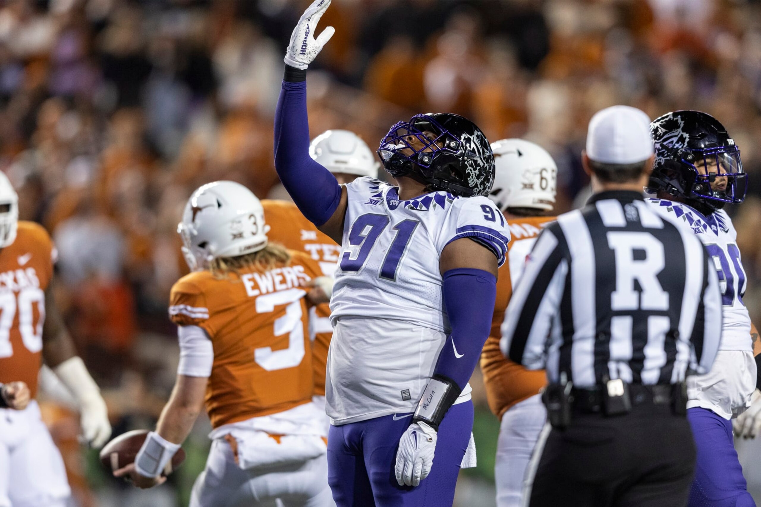 TCU defensive lineman Tymon Mitchell (91) celebrates a sack of Texas quarterback Quinn Ewers (3) during the second half of an NCAA college football game Saturday, Nov. 12, 2022, in Austin, Texas. (AP Photo/Stephen Spillman) TCU defensive lineman Tymon Mitchell (91) celebrates a sack of Texas quarterback Quinn Ewers (3) during the second half of an NCAA college football game Saturday, Nov. 12, 2022, in Austin, Texas. (AP Photo/Stephen Spillman)