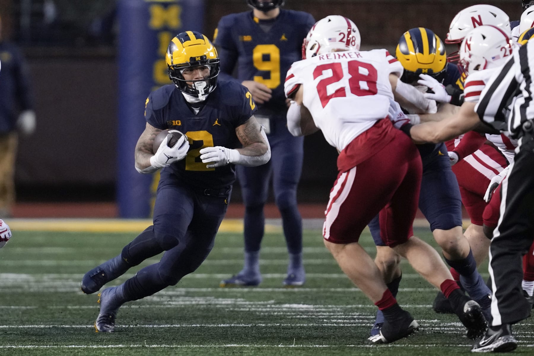 Michigan running back Blake Corum (2) runs the ball against the Nebraska in the first half of an NCAA college football game in Ann Arbor, Mich., Saturday, Nov. 12, 2022. (AP Photo/Paul Sancya)