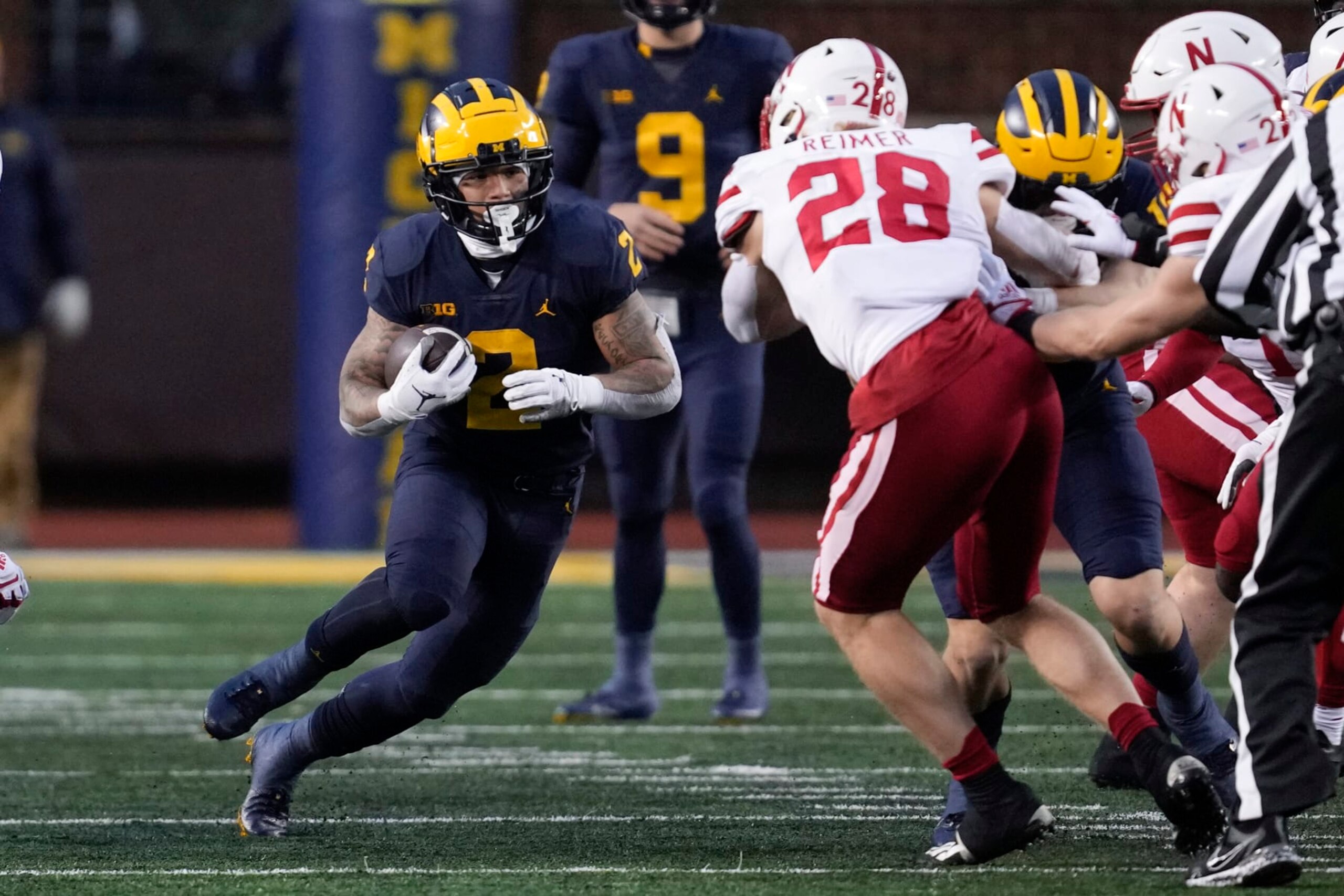 Michigan running back Blake Corum (2) runs the ball against the Nebraska in the first half of an NCAA college football game in Ann Arbor, Mich., Saturday, Nov. 12, 2022. (AP Photo/Paul Sancya)