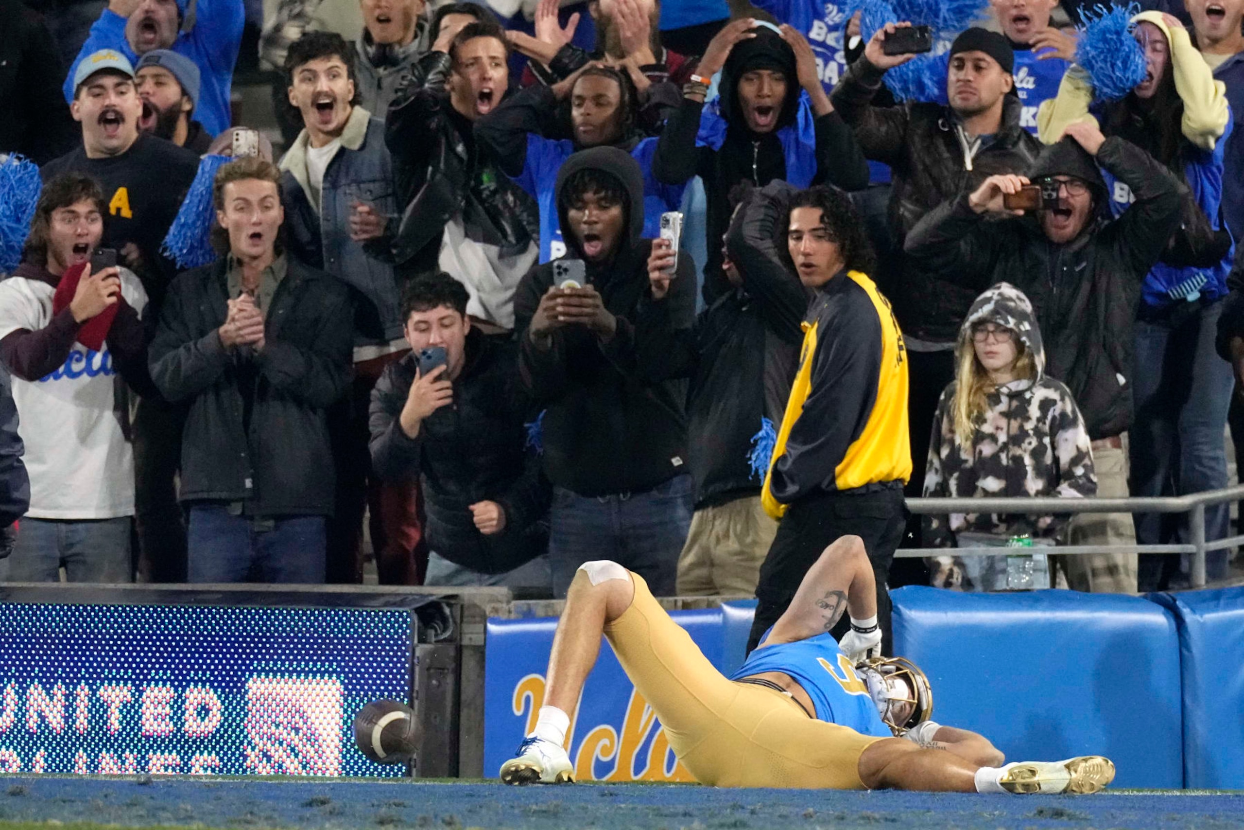 UCLA wide receiver Jake Bobo reacts after being unable to hold on to a ball thrown to the end zone with no time left in an NCAA college football game against Arizona Saturday, Nov. 12, 2022, in Pasadena, Calif. Arizona won 34-28. (AP Photo/Mark J. Terrill)