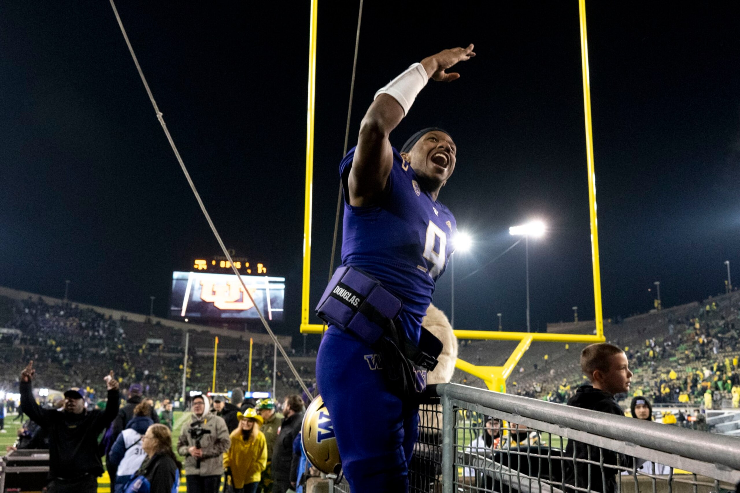 Washington quarterback Michael Penix Jr. (9) celebrates as he leaves Autzen Stadium after defeating Oregon in an NCAA college football game Saturday, Nov. 12, 2022, in Eugene, Ore. (AP Photo/Andy Nelson)