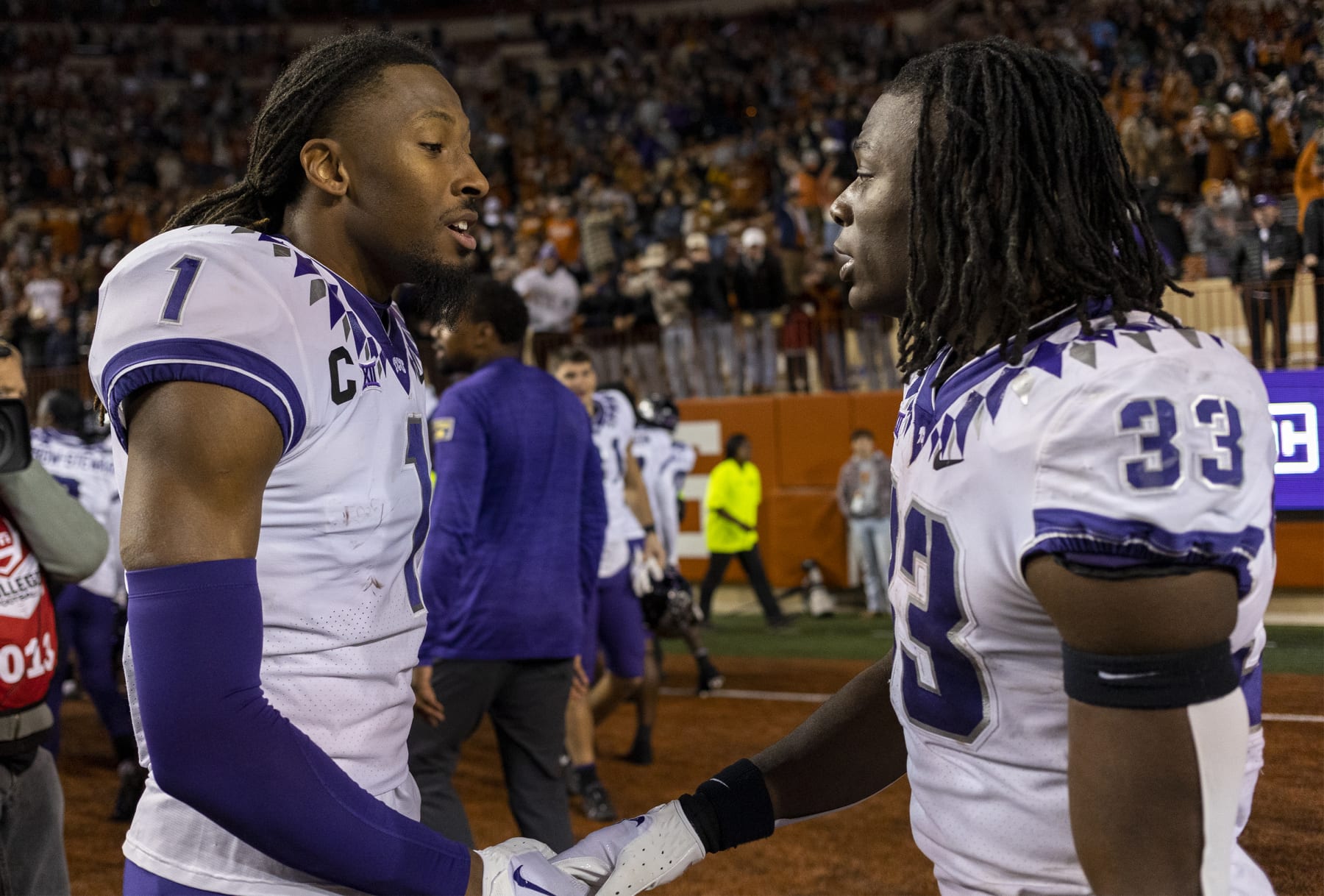 TCU's Quentin Johnston (1) and Kendre Miller (33)