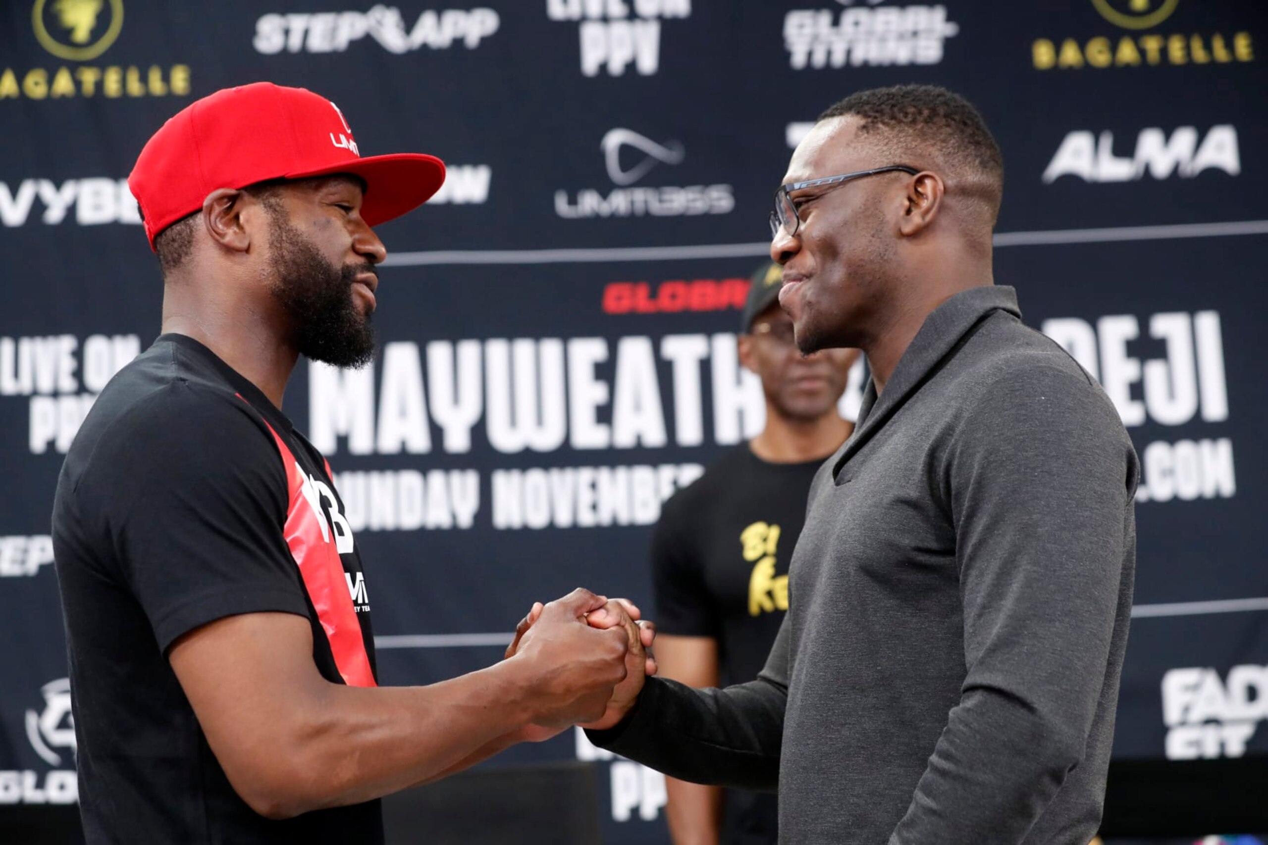 LAS VEGAS, NEVADA - OCTOBER 13: Floyd Mayweather Jr. (L) and Deji Olatunji shake hands during a news conference at the Mayweather Boxing Club on October 13, 2022 in Las Vegas, Nevada. Mayweather is scheduled to fight Olatunji in an exhibition match in Dubai on November 13, 2022. (Photo by Steve Marcus/Getty Images) LAS VEGAS, NEVADA - OCTOBER 13: Floyd Mayweather Jr. (L) and Deji Olatunji shake hands during a news conference at the Mayweather Boxing Club on October 13, 2022 in Las Vegas, Nevada. Mayweather is scheduled to fight Olatunji in an exhibition match in Dubai on November 13, 2022. (Photo by Steve Marcus/Getty Images)