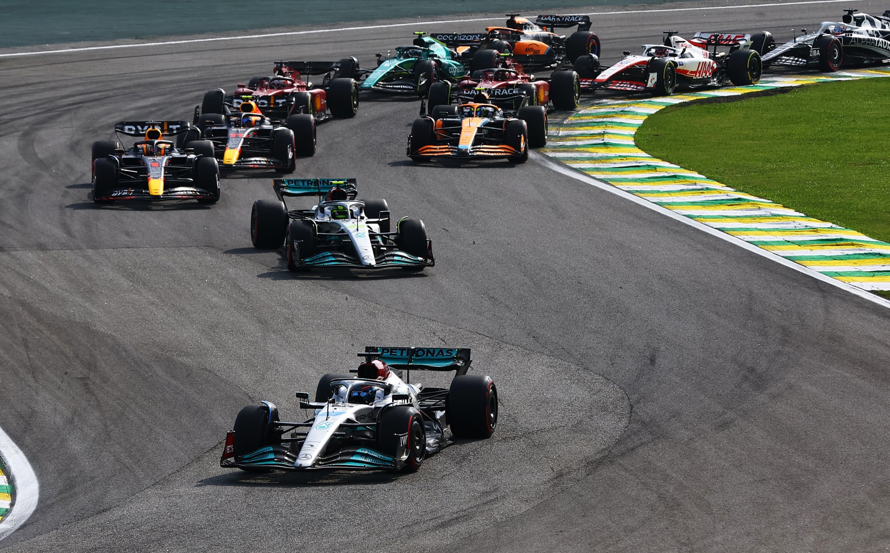SAO PAULO, BRAZIL - NOVEMBER 13: George Russell of Great Britain driving the (63) Mercedes AMG Petronas F1 Team W13 leads the field at the start during the F1 Grand Prix of Brazil at Autodromo Jose Carlos Pace on November 13, 2022 in Sao Paulo, Brazil. (Photo by Mark Thompson/Getty Images)