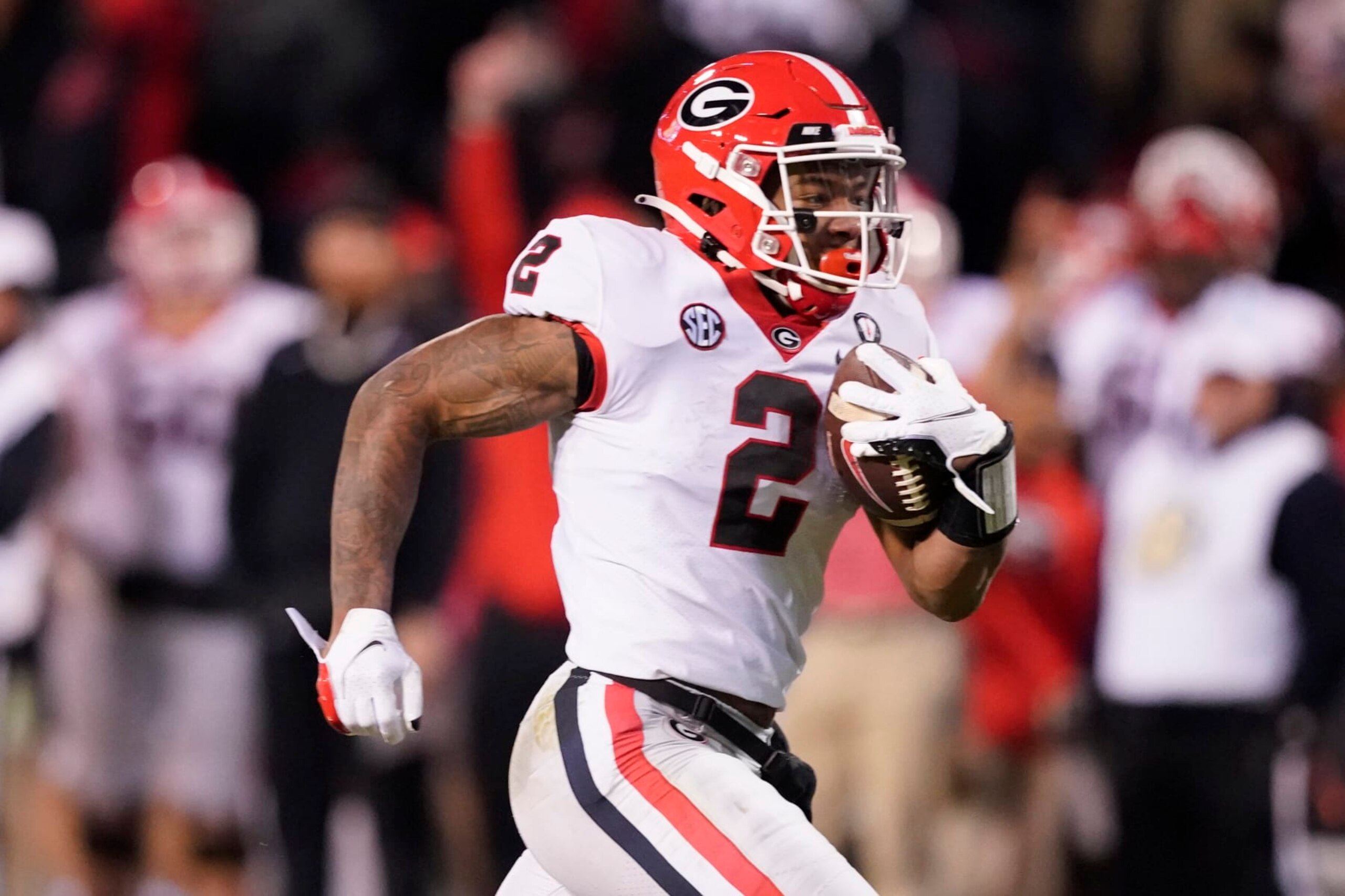 Georgia running back Kendall Milton (2) sprints his way to a 34-yard touchdown run against Mississippi State during the second half of an NCAA college football game in Starkville, Miss., Saturday, Nov. 12, 2022. (AP Photo/Rogelio V. Solis)