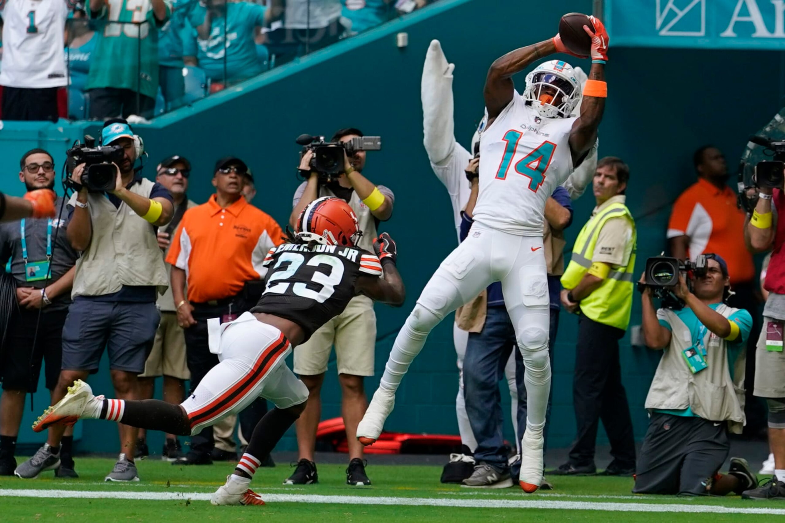 Miami Dolphins wide receiver Trent Sherfield (14) catches a touchdown pass as Cleveland Browns cornerback Martin Emerson Jr. (23) is late with the tackle during the first half of an NFL football game, Sunday, Nov. 13, 2022, in Miami Gardens, Fla. (AP Photo/Lynne Sladky) Miami Dolphins wide receiver Trent Sherfield (14) catches a touchdown pass as Cleveland Browns cornerback Martin Emerson Jr. (23) is late with the tackle during the first half of an NFL football game, Sunday, Nov. 13, 2022, in Miami Gardens, Fla. (AP Photo/Lynne Sladky)