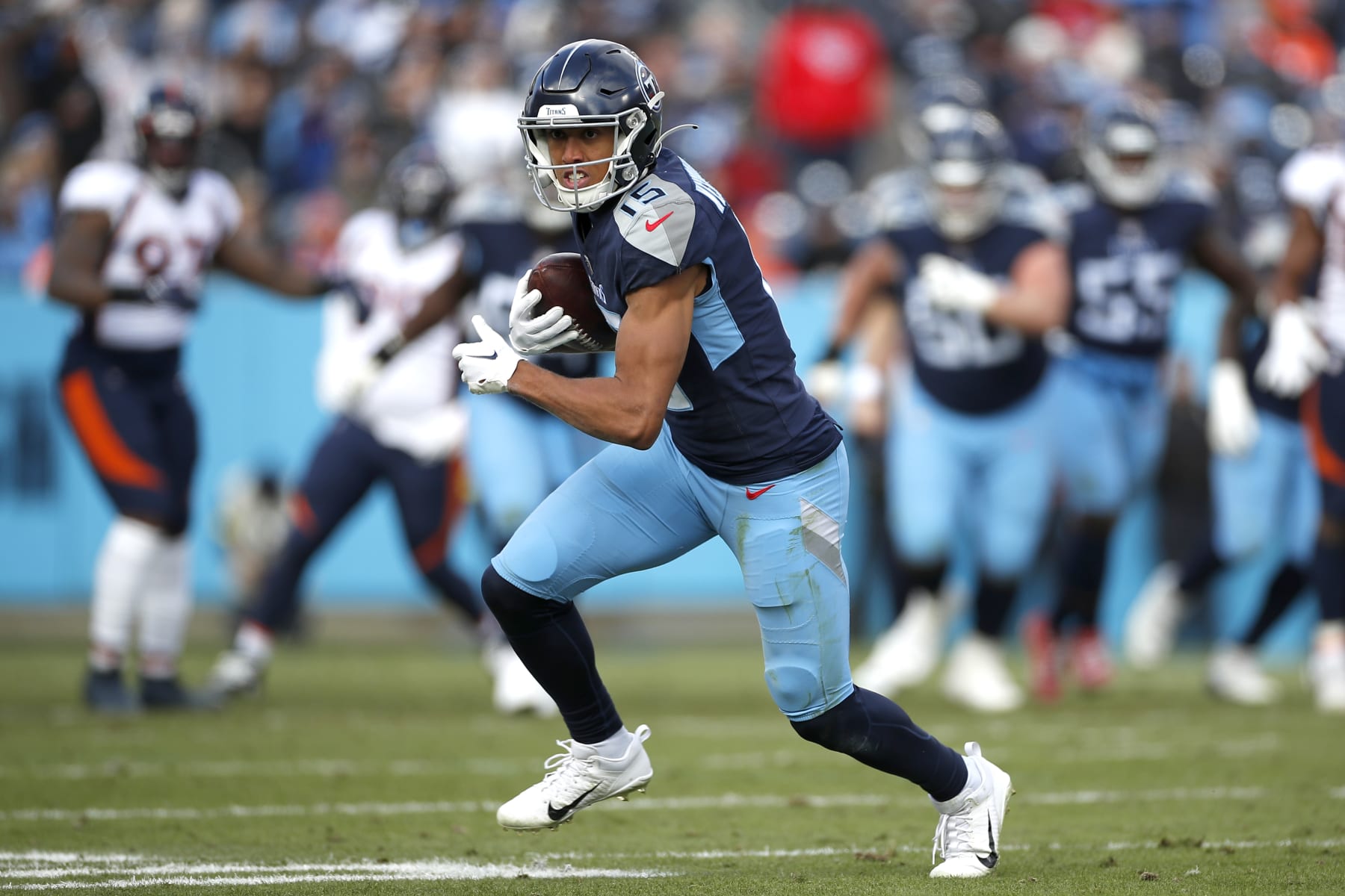 NASHVILLE, TENNESSEE - NOVEMBER 13: Nick Westbrook-Ikhine #15 of the Tennessee Titans runs upfield after making a catch during the second quarter against the Denver Broncos at Nissan Stadium on November 13, 2022 in Nashville, Tennessee. (Photo by Silas Walker/Getty Images)